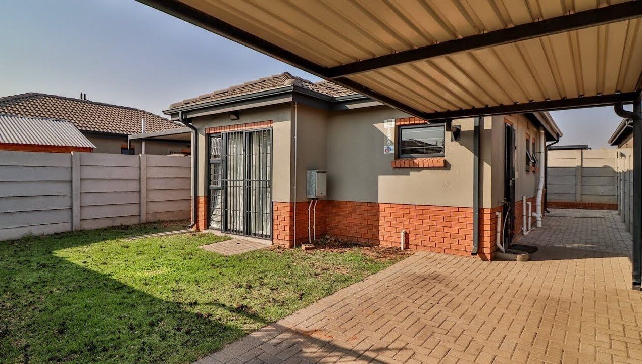 Charming outdoor space at Nails by Nelz, Alberton, Gauteng, ZA showcasing brick and paving details.