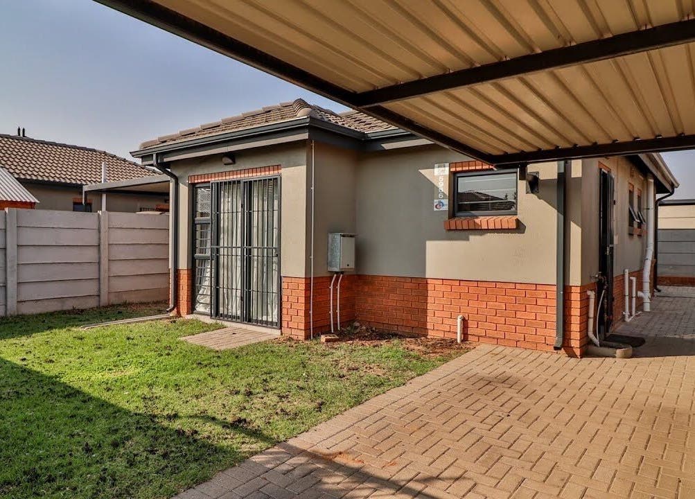 Charming outdoor space at Nails by Nelz, Alberton, Gauteng, ZA showcasing brick and paving details.