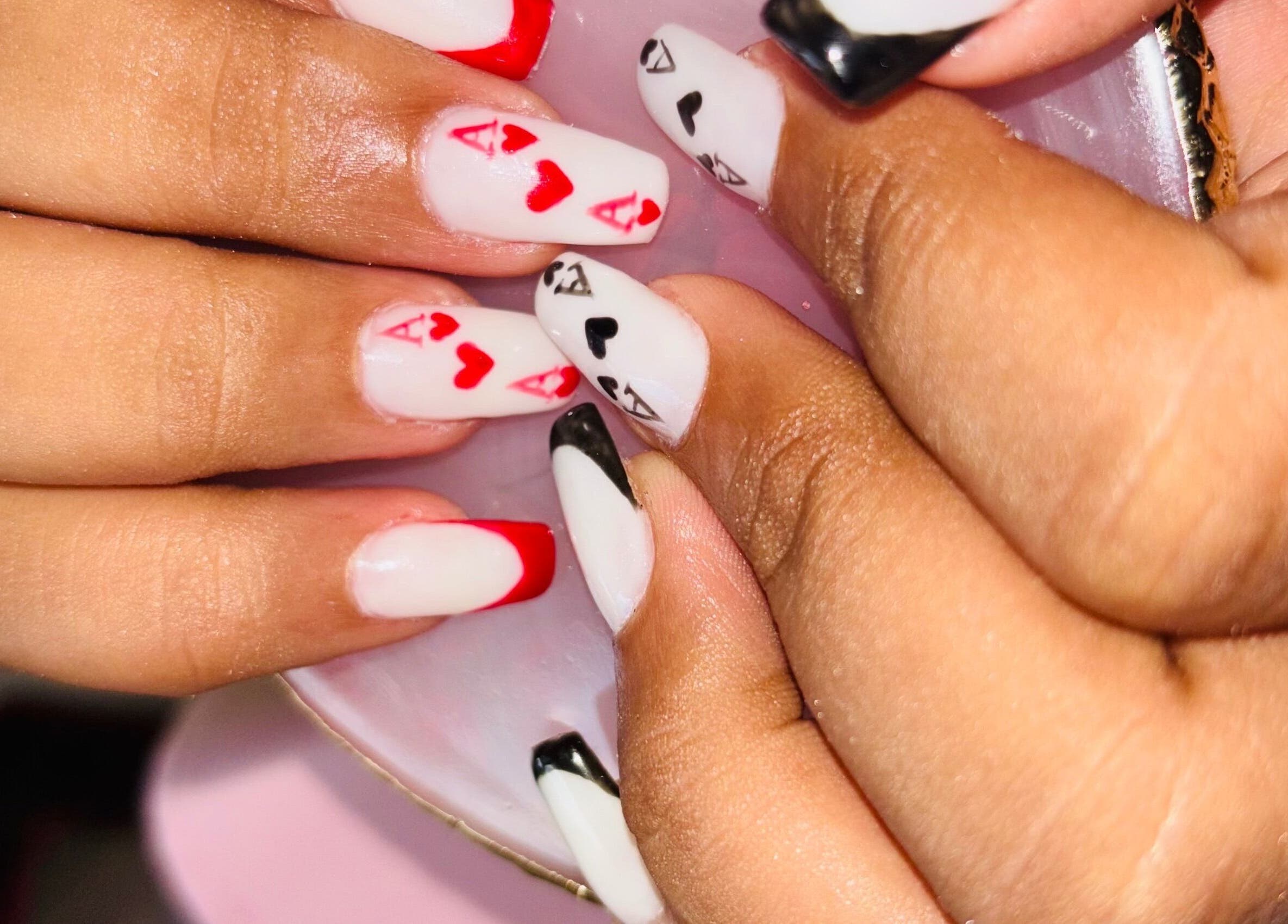 Poker-themed nail art at Nails by Nelz in Alberton, Gauteng, ZA, featuring red and black designs.