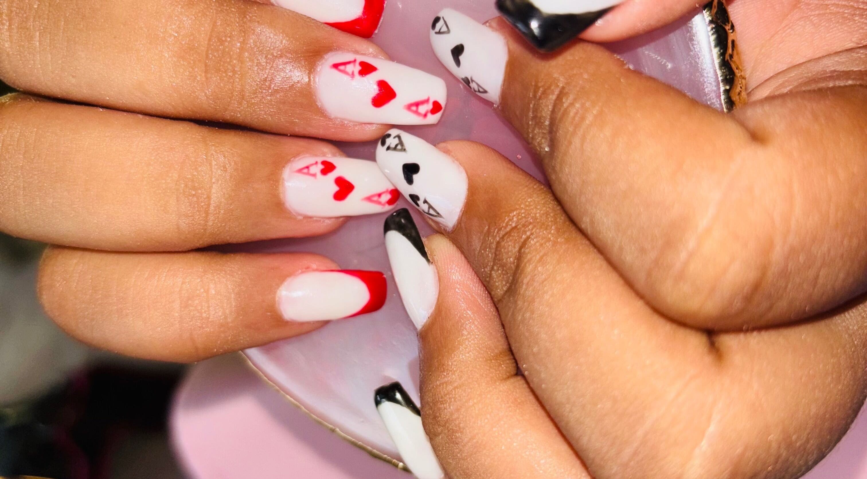 Poker-themed nail art at Nails by Nelz in Alberton, Gauteng, ZA, featuring red and black designs.