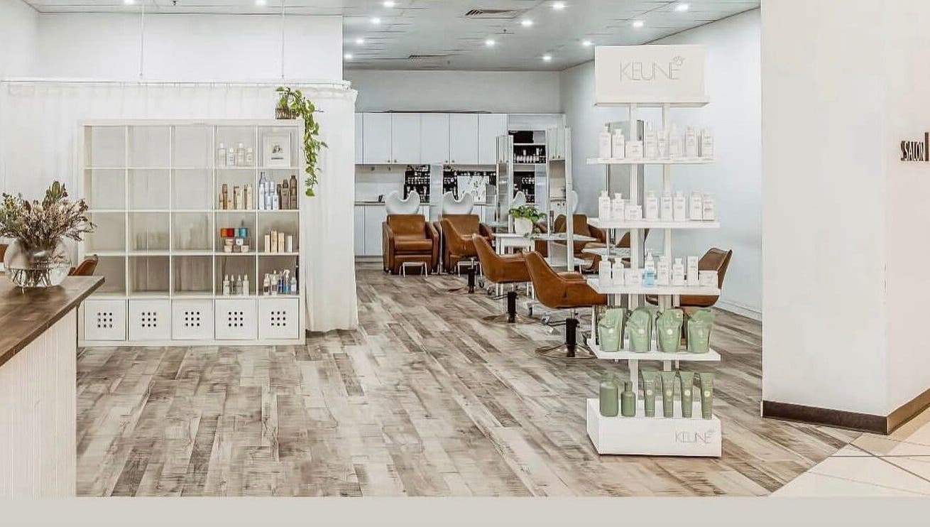 Chic interior of Elixir eyelash extensions, Southport, Queensland, AU, with modern chairs and shelves.