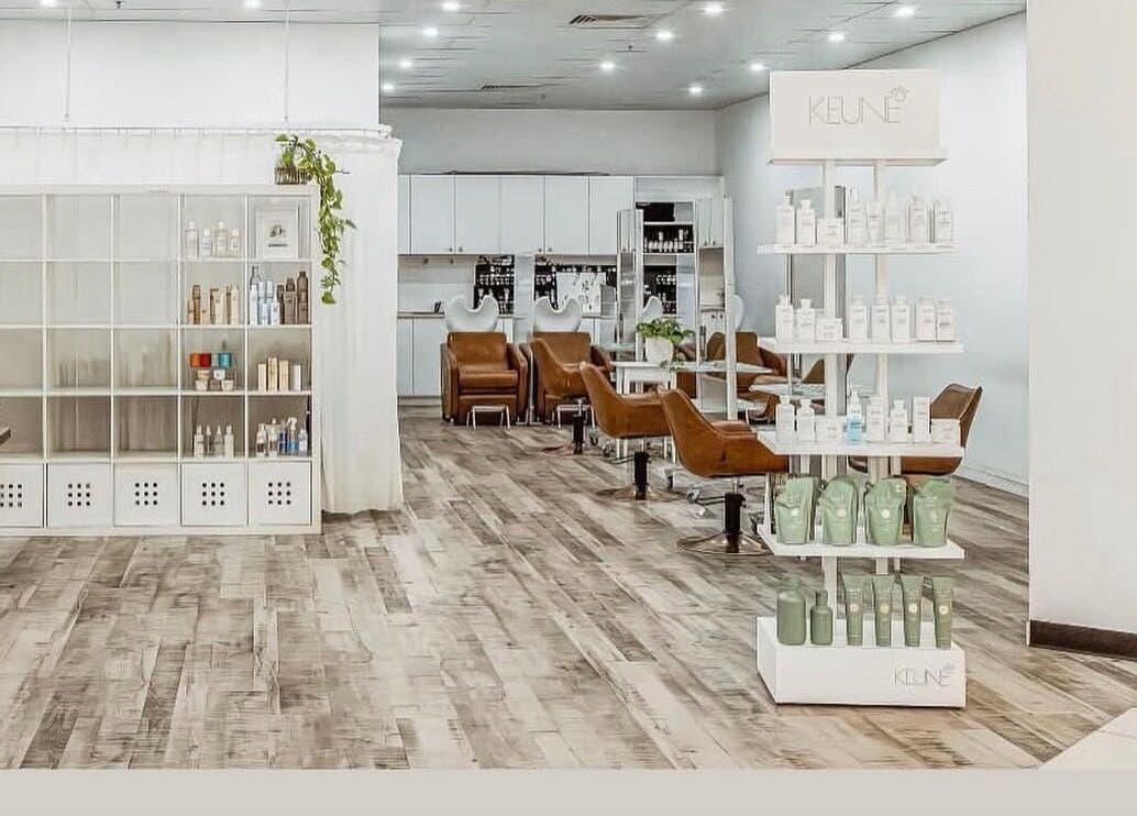 Chic interior of Elixir eyelash extensions, Southport, Queensland, AU, with modern chairs and shelves.