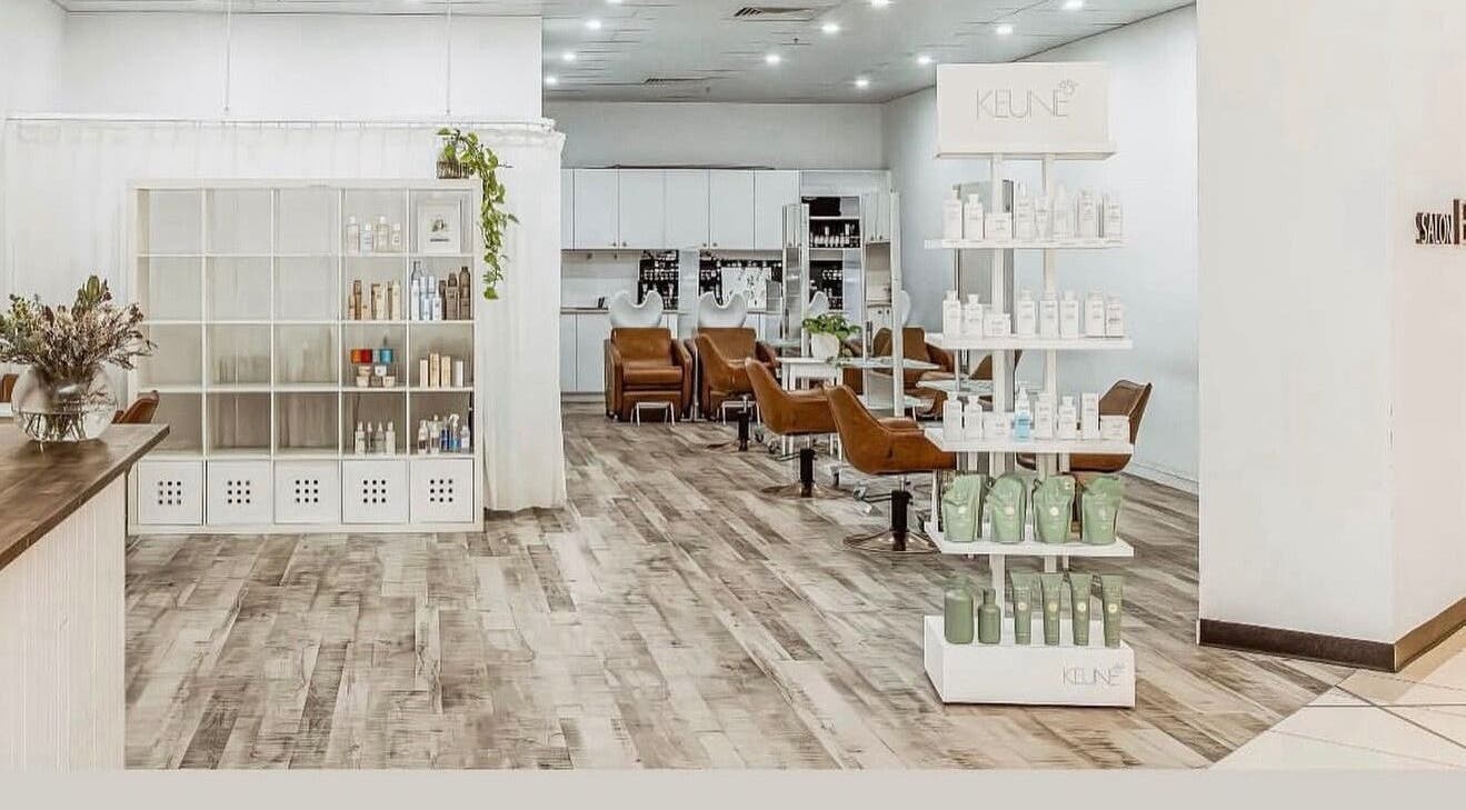 Chic interior of Elixir eyelash extensions, Southport, Queensland, AU, with modern chairs and shelves.