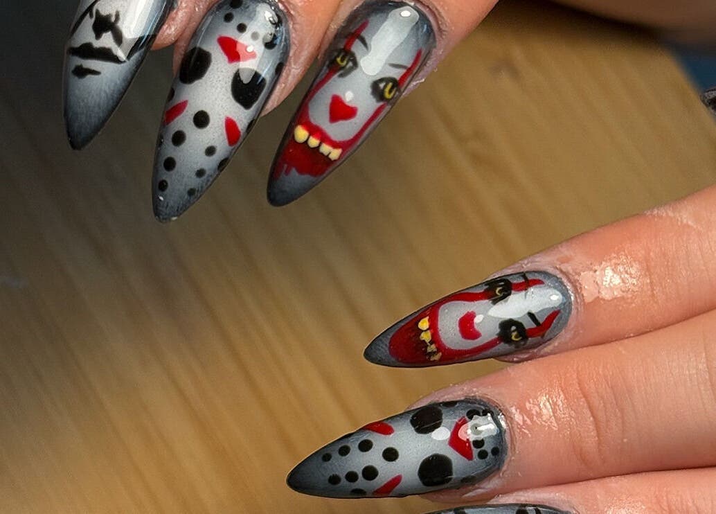 Unique spooky nail art at Glossy Babe, Wakefield, England, GB, featuring creepy designs on long nails.