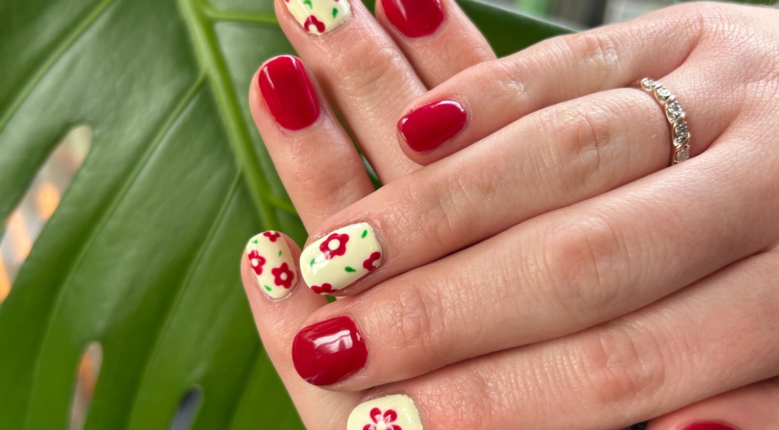 Bold red and floral nail art at Vinyls & Varnish Beauty Studio, Perth, Tasmania, AU.