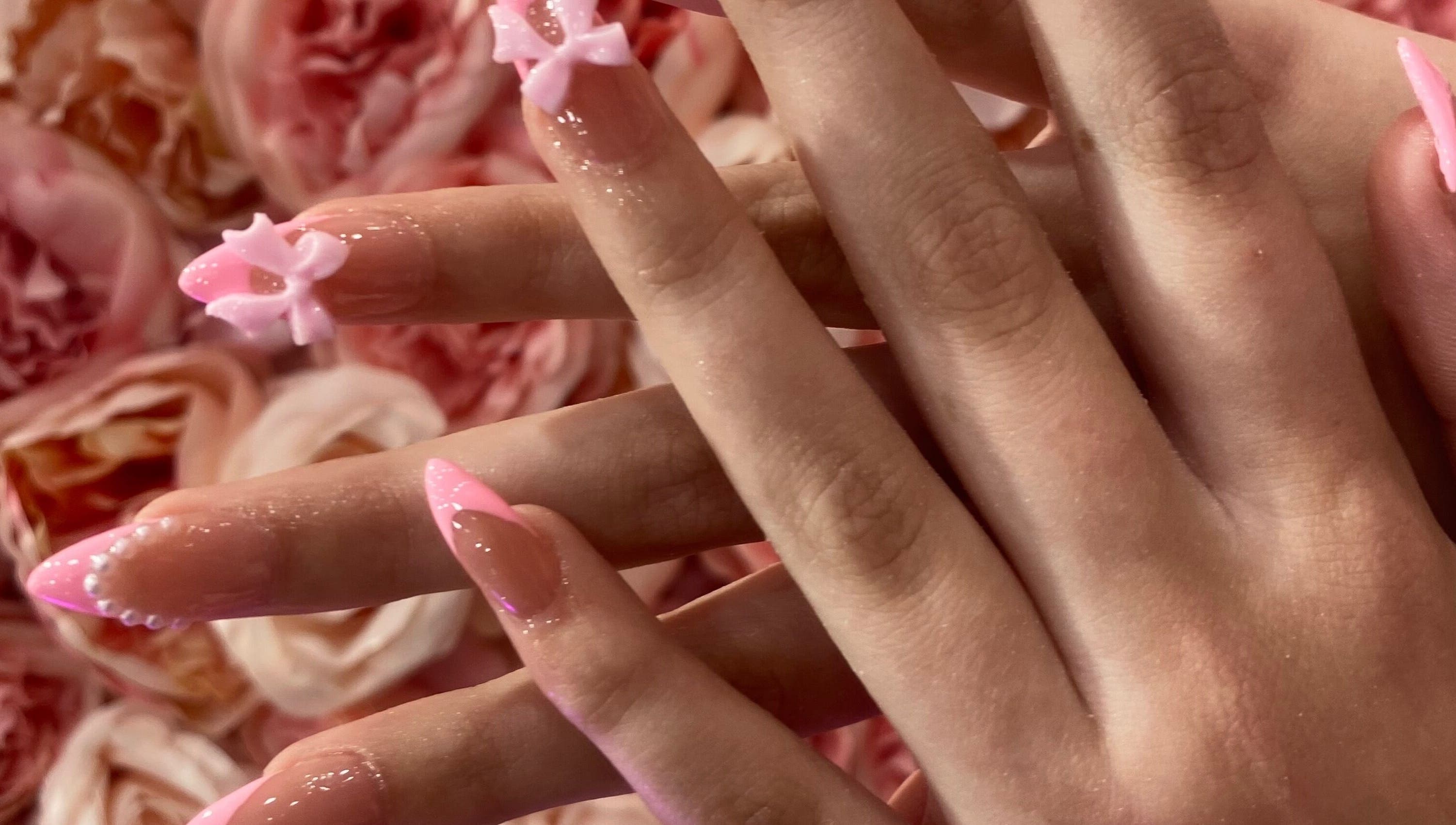 Elegant floral nail art at Ash Beauty Collective in Cape Town, Western Cape, ZA, showcasing intricate pink designs.