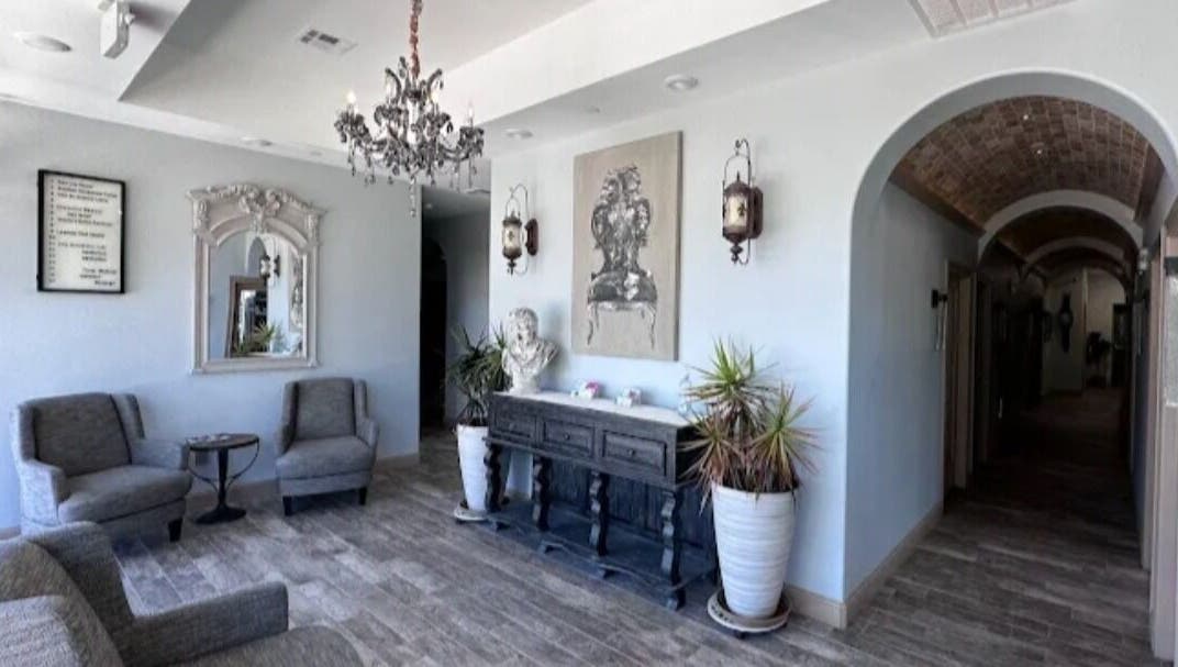 Chic interior with chandelier at Viva la Vicksen, Leander, Texas, US, featuring cozy chairs and decor.