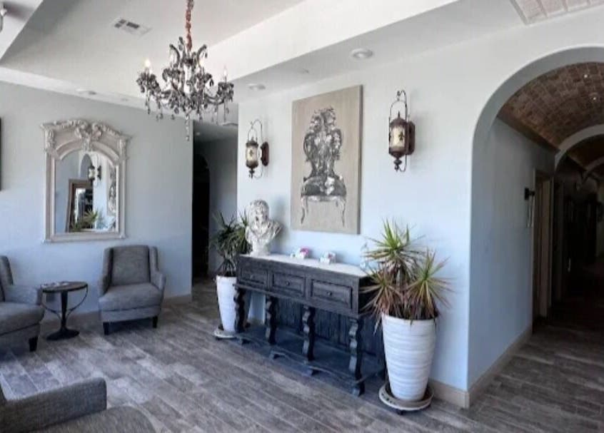 Chic interior with chandelier at Viva la Vicksen, Leander, Texas, US, featuring cozy chairs and decor.