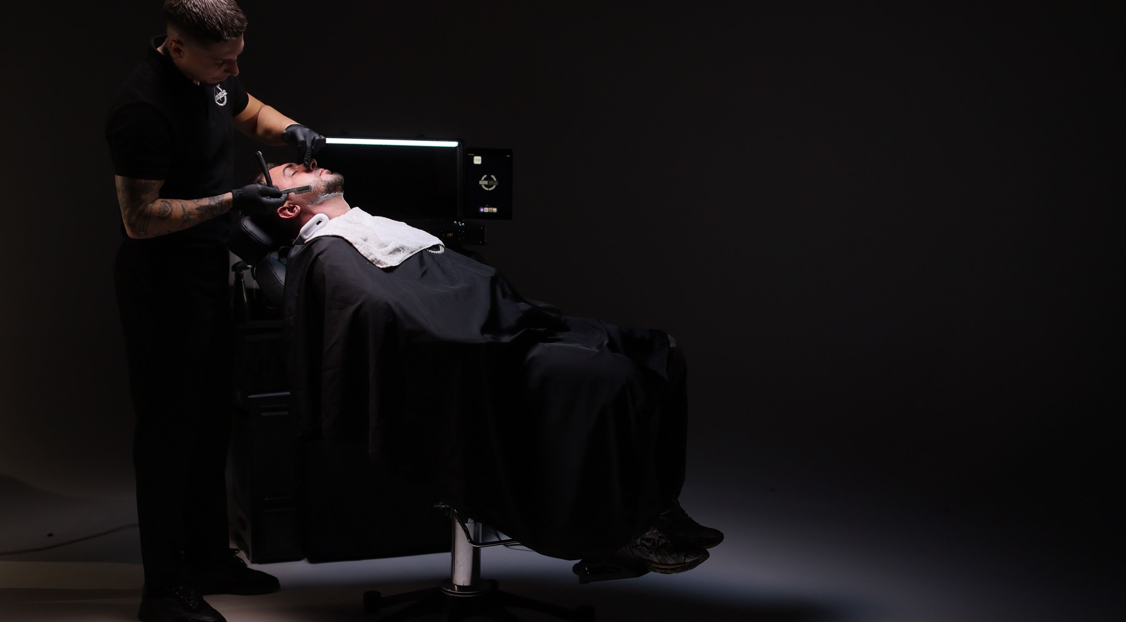 Barber providing a premium shave at Elite Home Private Barber in Dubai, Dubai, AE.