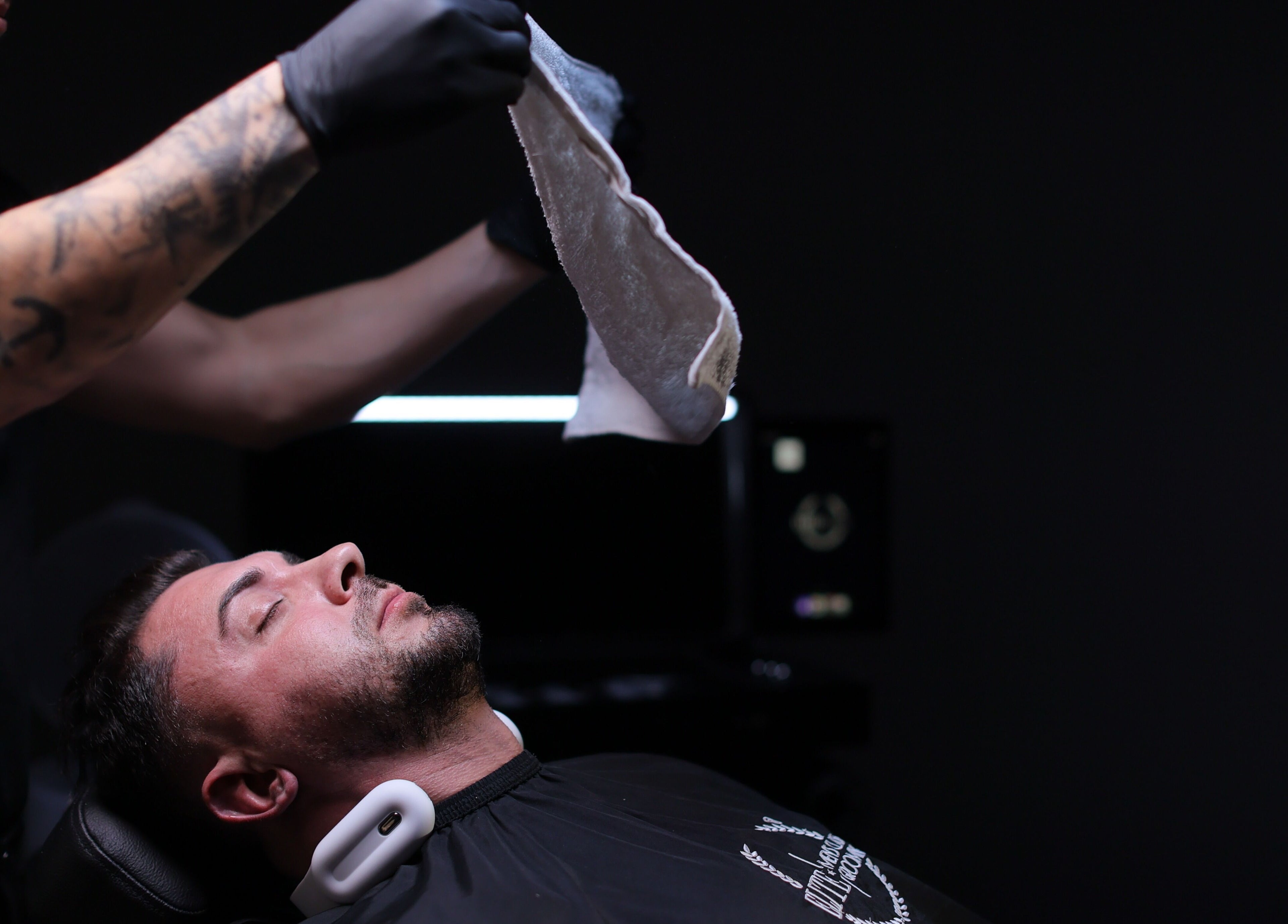 Luxury grooming at Elite Home Private Barber in Dubai, Dubai, AE featuring a hot towel treatment.
