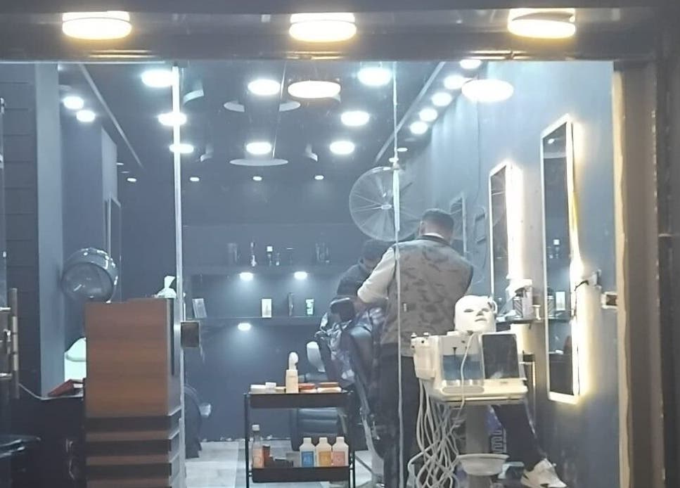 Modern salon interior with a stylist working at Haircut, Cairo Governorate, Cairo Governorate, EG.
