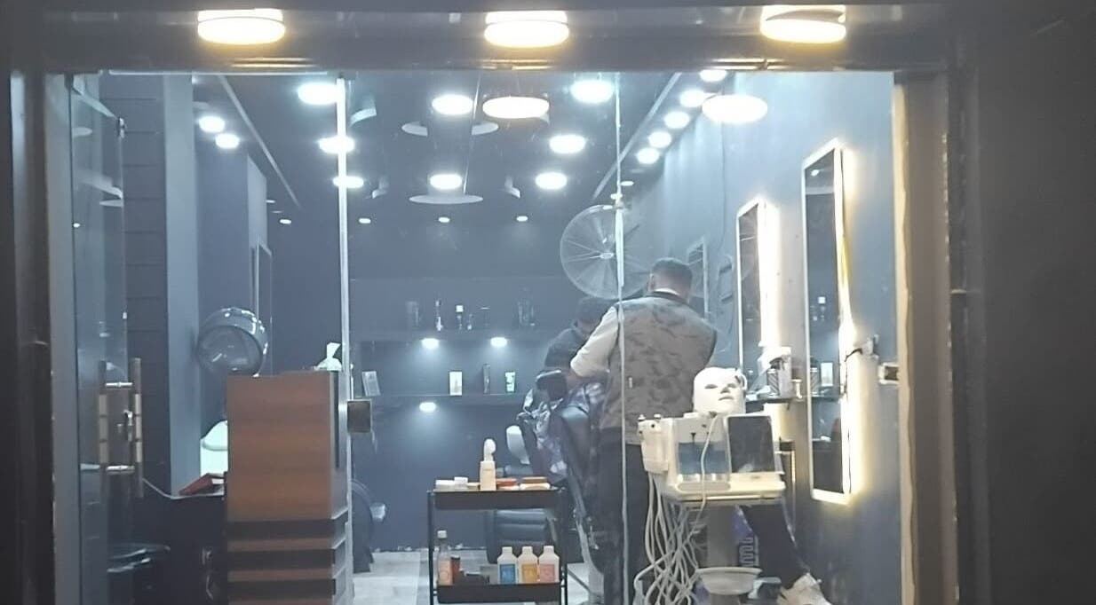 Modern salon interior with a stylist working at Haircut, Cairo Governorate, Cairo Governorate, EG.