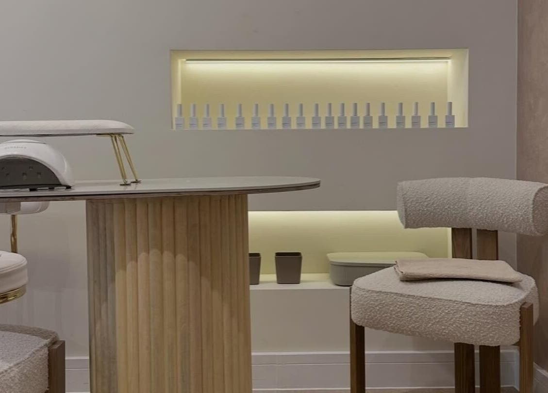 Modern nail setup at Nails By Bel, Clayton-le-woods, England, GB, featuring stylish chairs and workspace.