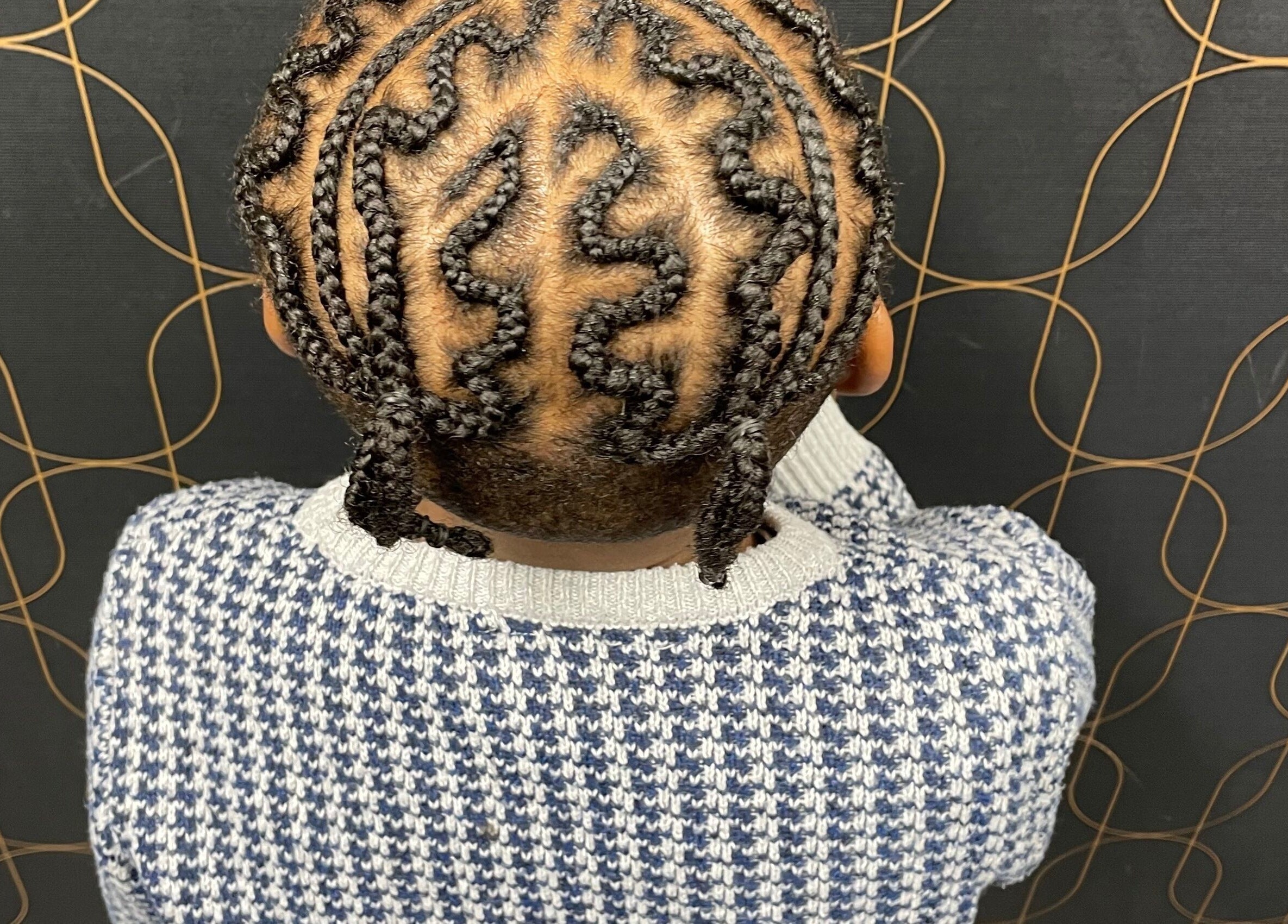 Stylish braided hairstyle showcased in Catford, London, England, GB, highlighting unique braid patterns.