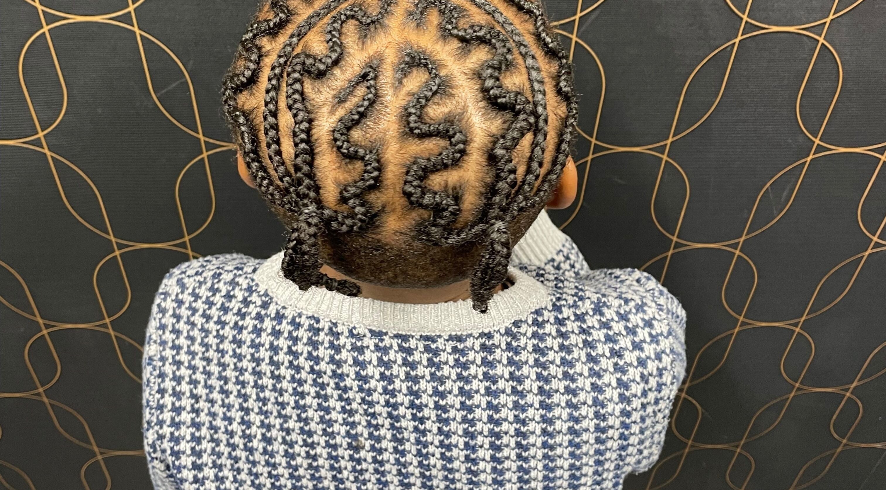 Stylish braided hairstyle showcased in Catford, London, England, GB, highlighting unique braid patterns.
