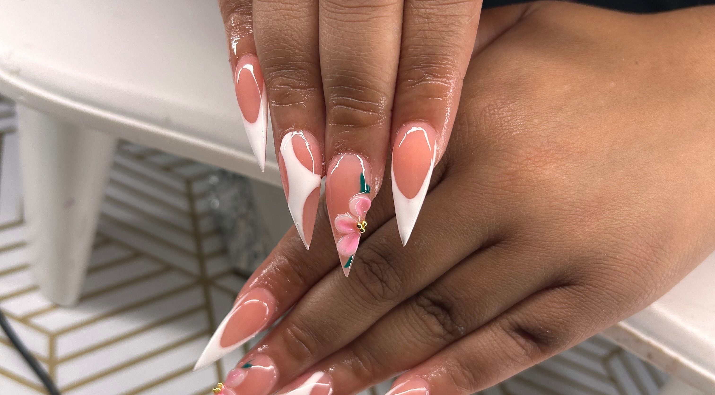 Beautiful nail art with floral design at KCK nails, Swainsboro, Georgia, US.