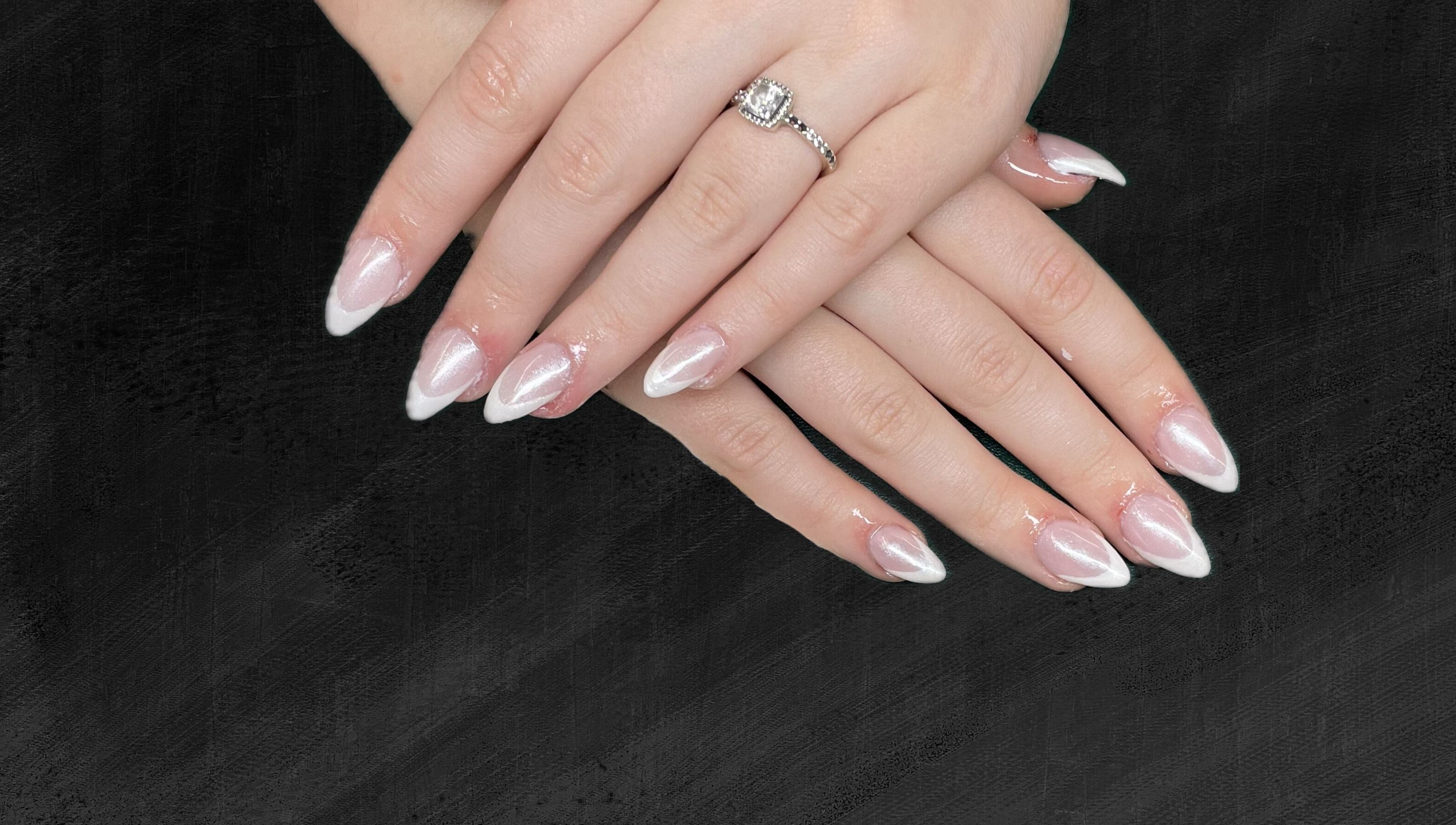 Elegant French manicure at The Nail Cabin - Muskoka, Huntsville, Ontario, CA showing beautifully polished nails.