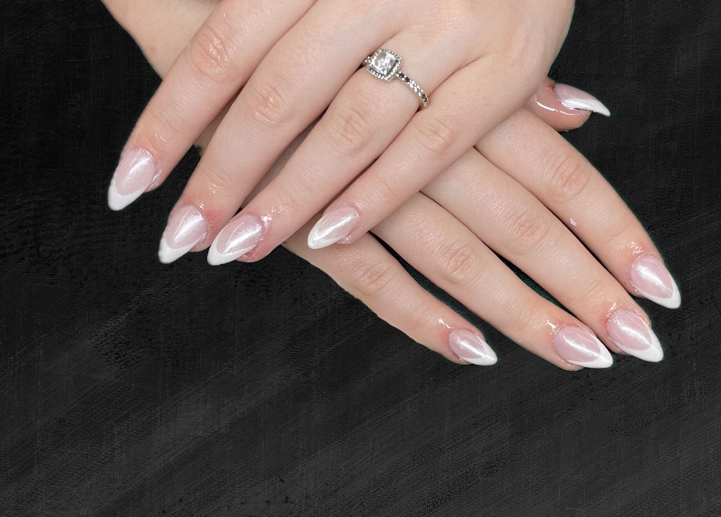 Elegant French manicure at The Nail Cabin - Muskoka, Huntsville, Ontario, CA showing beautifully polished nails.