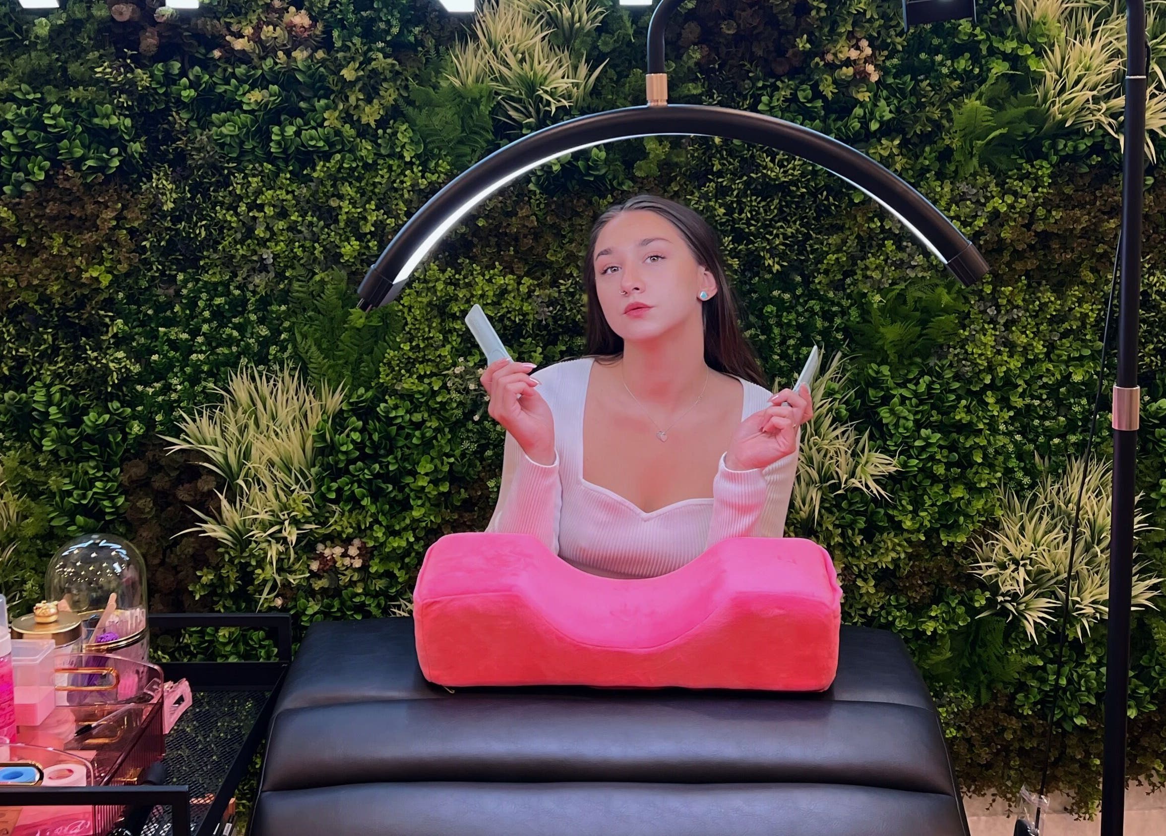 Relaxing lash service at Frances Lash Art, Vancouver, British Columbia, CA, featuring a lush green backdrop.