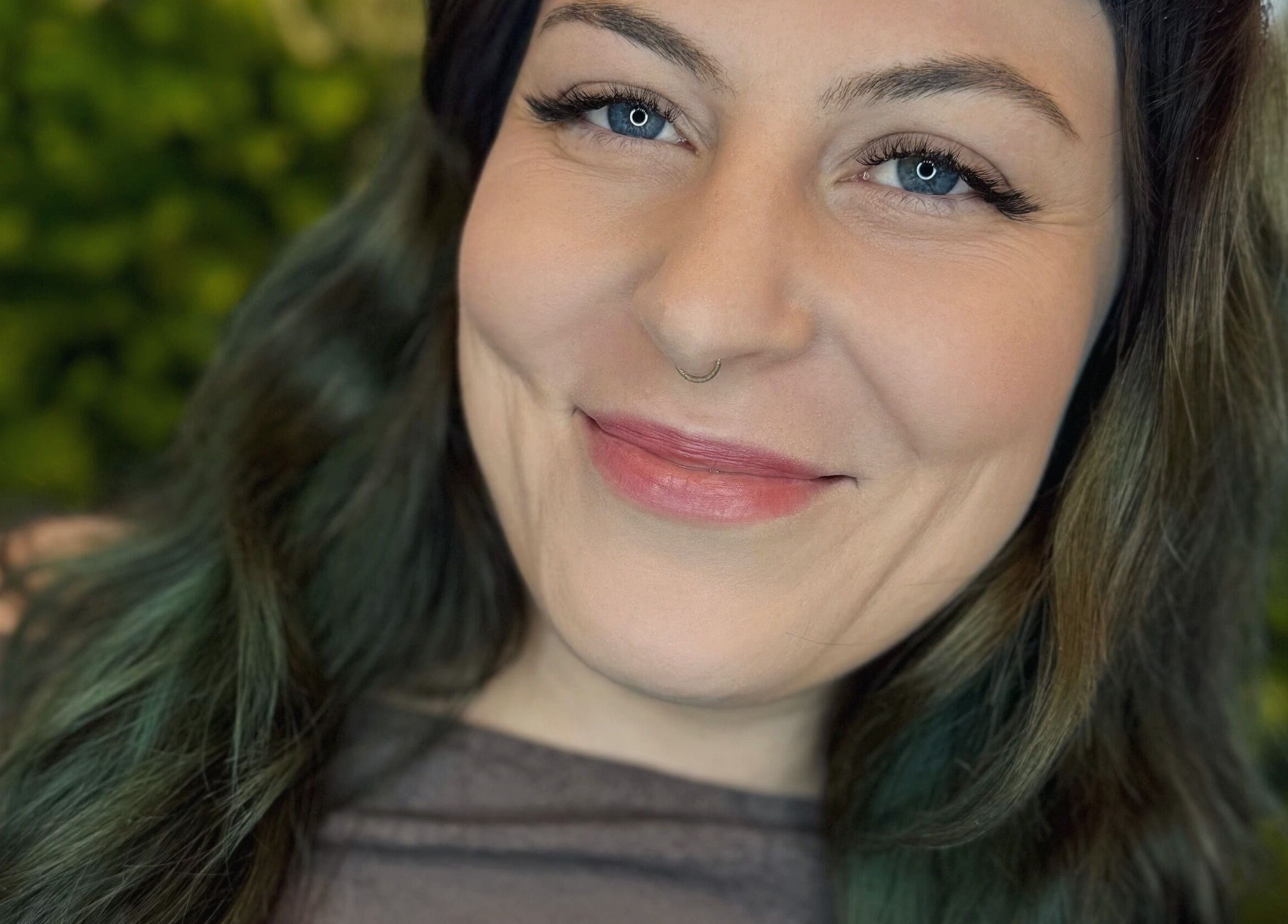 Smiling client after lash service at Frances Lash Art in Vancouver, British Columbia, CA.