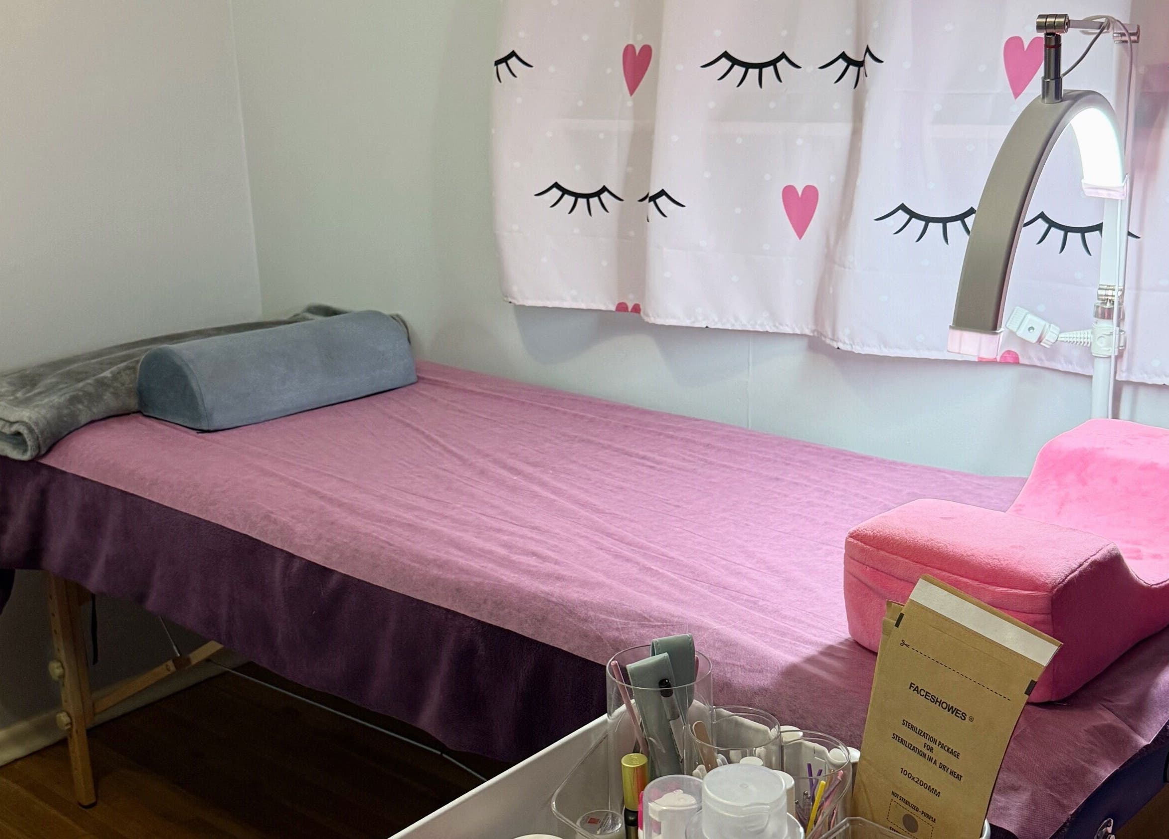 Relaxing treatment room at Frances Lash & Brows Nort Van, Vancouver, British Columbia, CA, featuring a soft pink bed.