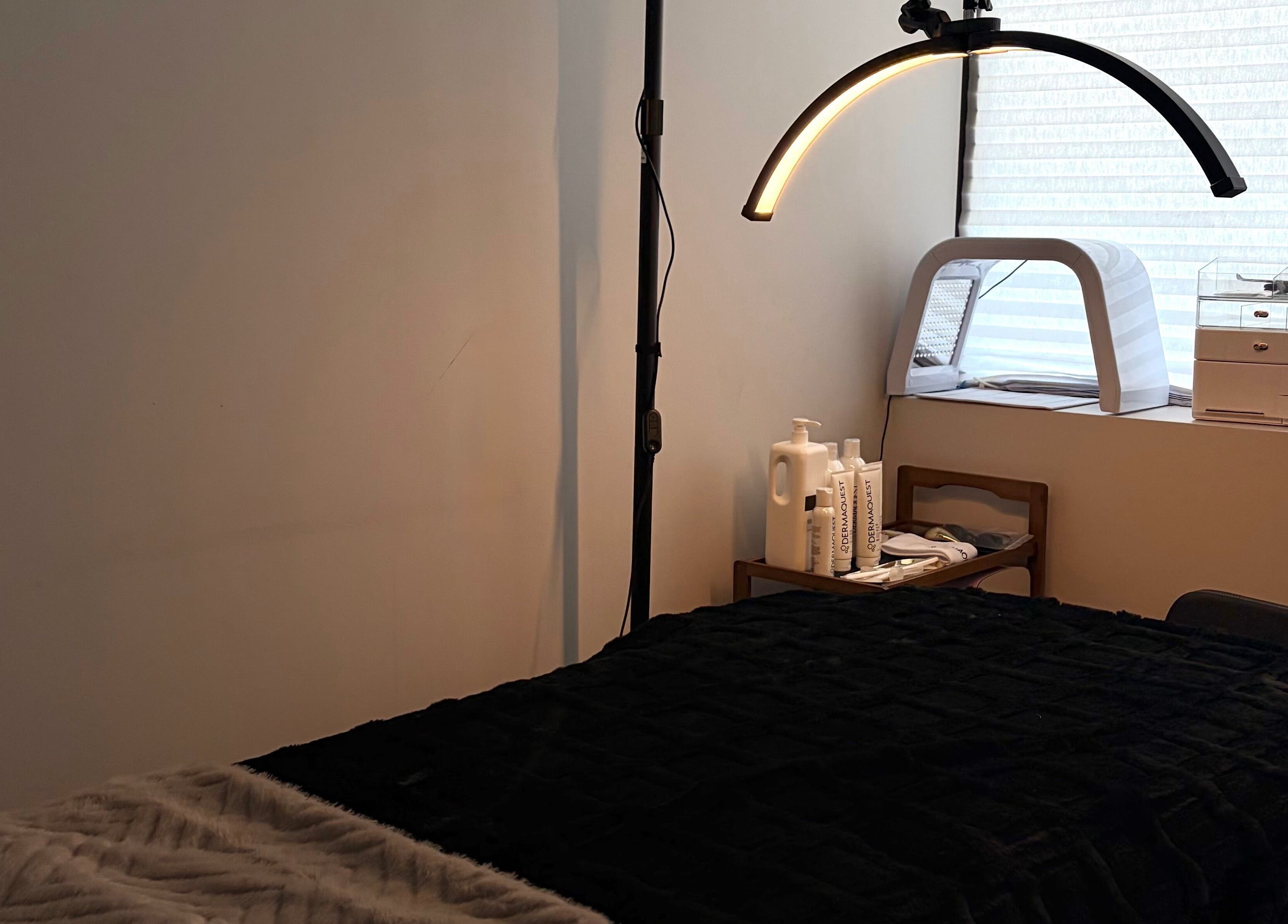 Cozy treatment room at Mkytheskindiary, Vaughan, Ontario, CA with a massage table and spa tools.