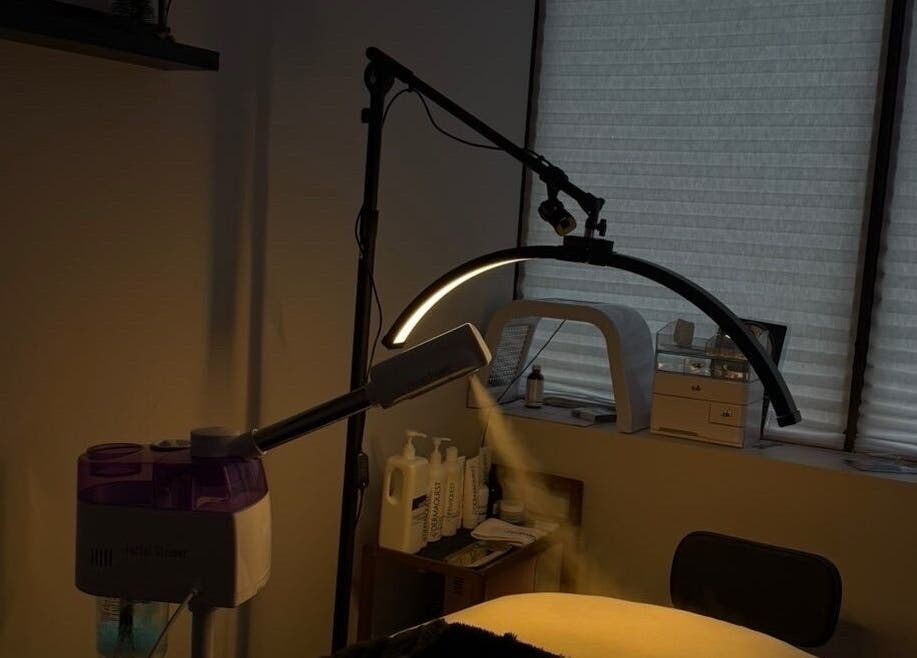 Spa room with treatment setup at Mkytheskindiary, Vaughan, Ontario, CA. Soft lighting and equipment create a calming ambiance.