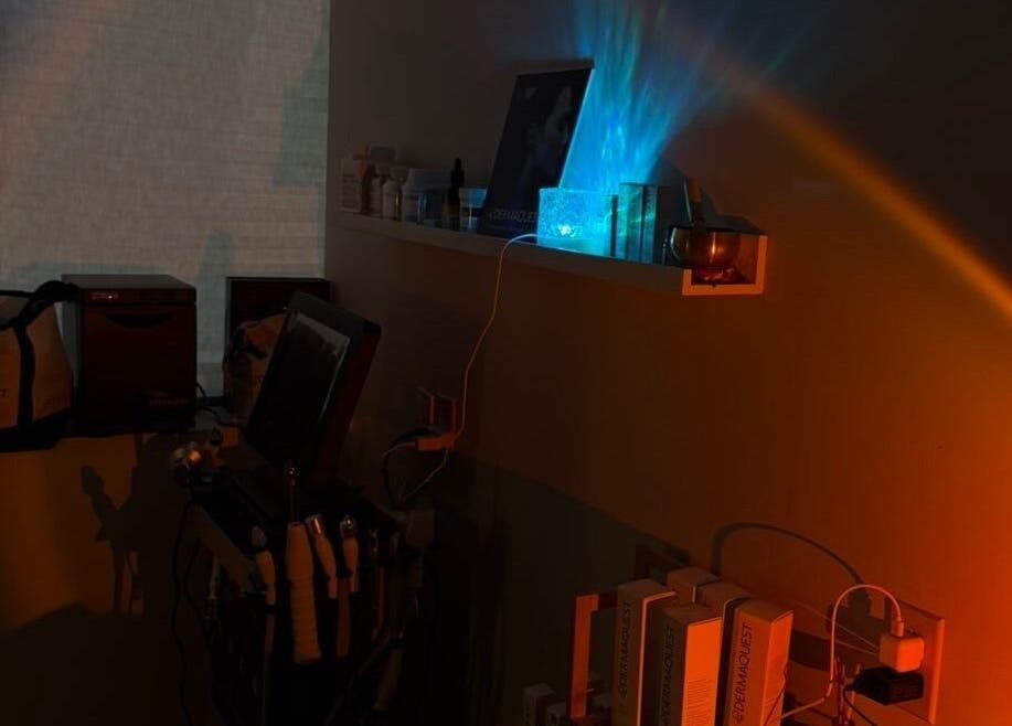 Dimly lit wellness setup at Mkytheskindiary, Vaughan, Ontario, CA, featuring skincare tools and ambient lighting.