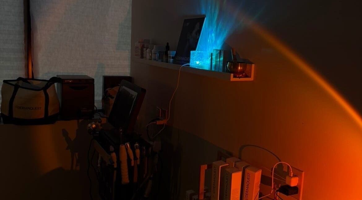 Dimly lit wellness setup at Mkytheskindiary, Vaughan, Ontario, CA, featuring skincare tools and ambient lighting.