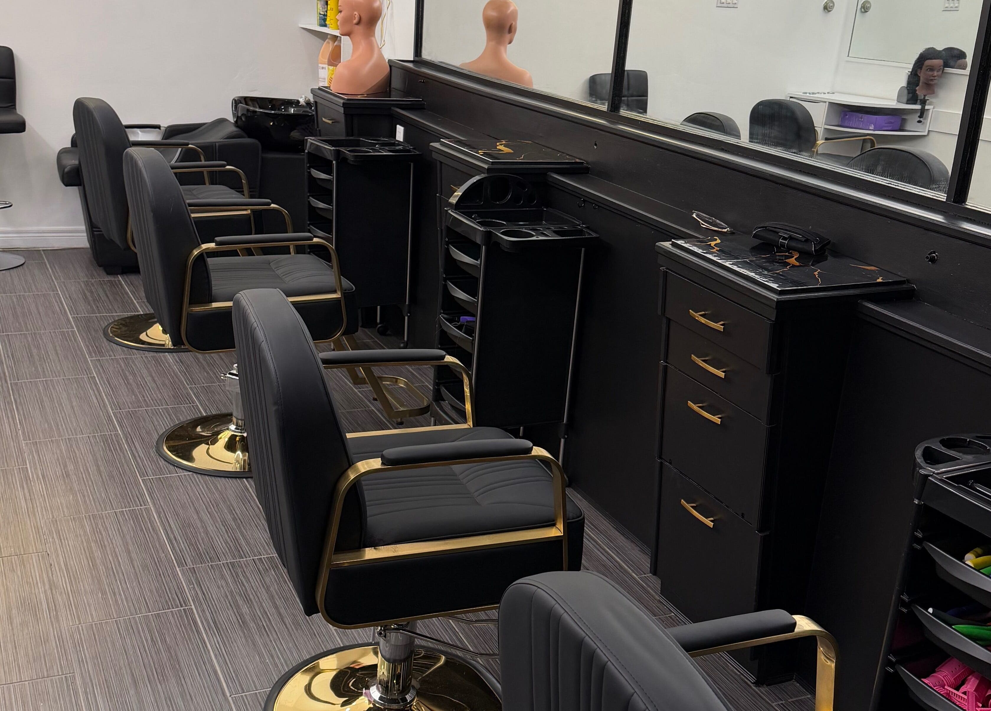 Modern styling chairs at Hair Affairs Braiding Parlor, Toronto, Ontario, CA, showcasing sleek design and comfort.