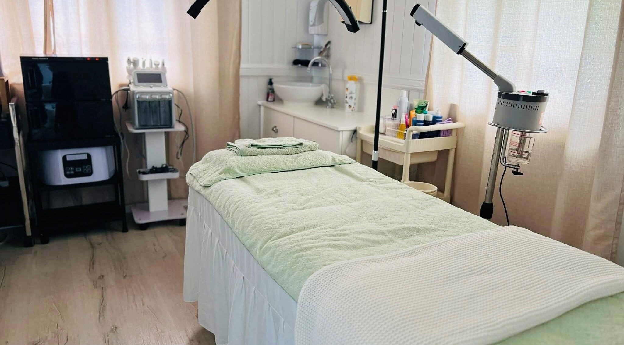 Tranquil spa room at Adore.Facial in Hawthorne, Queensland, AU, featuring a comfortable massage bed.