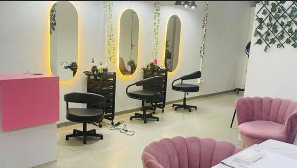 Stylish interior of Revive beauty salon in Pimpri-Chinchwad, Maharashtra, showcasing modern styling chairs and mirrors.