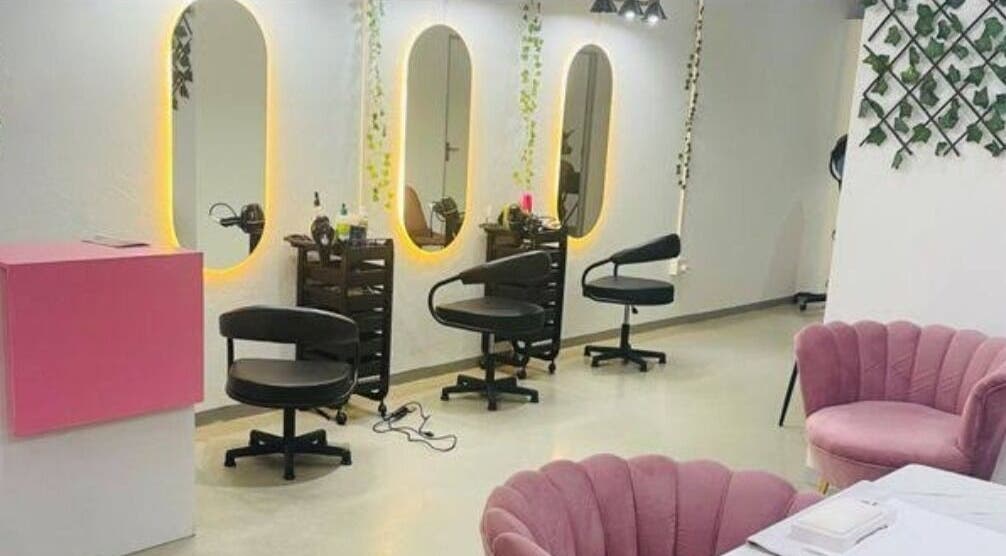 Stylish interior of Revive beauty salon in Pimpri-Chinchwad, Maharashtra, showcasing modern styling chairs and mirrors.