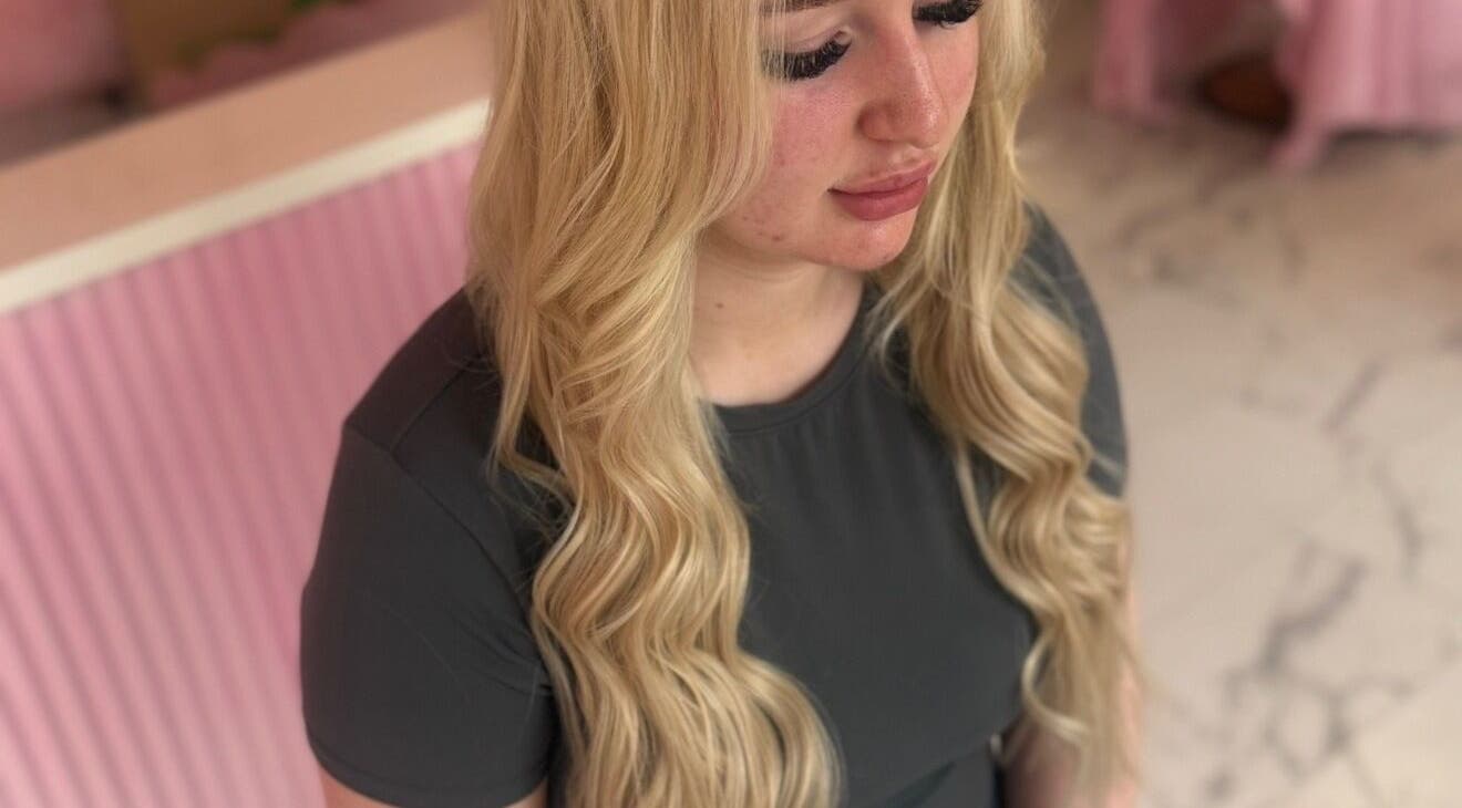 Blonde woman with curls at Looks and Locks By Taylor in Larkhall, Scotland, GB.