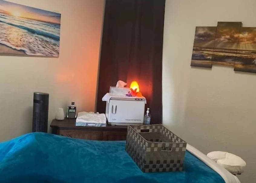 Relaxing spa treatment room at Abbey Moonlight Spa in Oklahoma City, Oklahoma, US with tranquil decor.