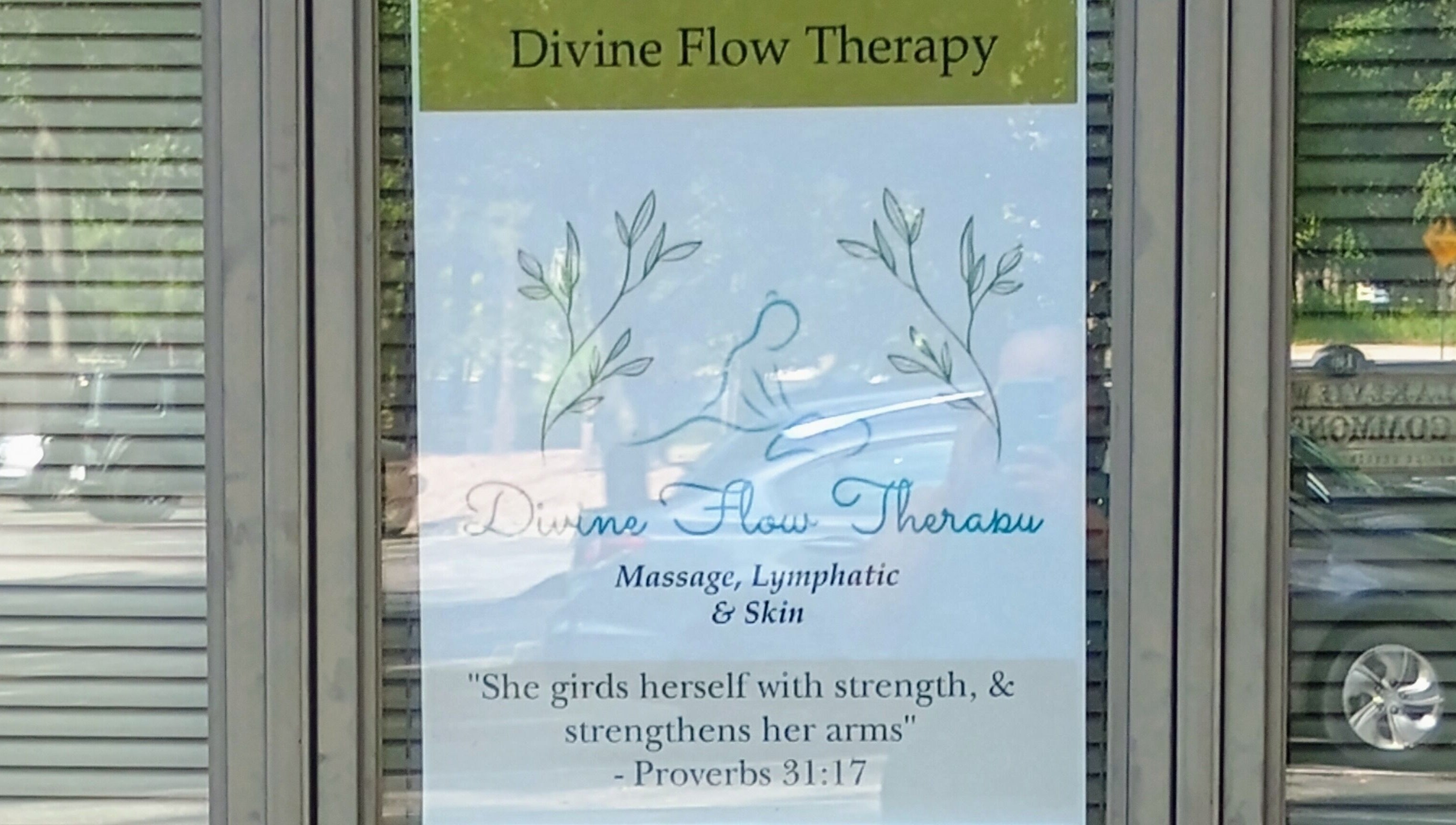 Sign at Divine Flow Therapy offering massage and skincare in Gibbsboro, New Jersey, US.