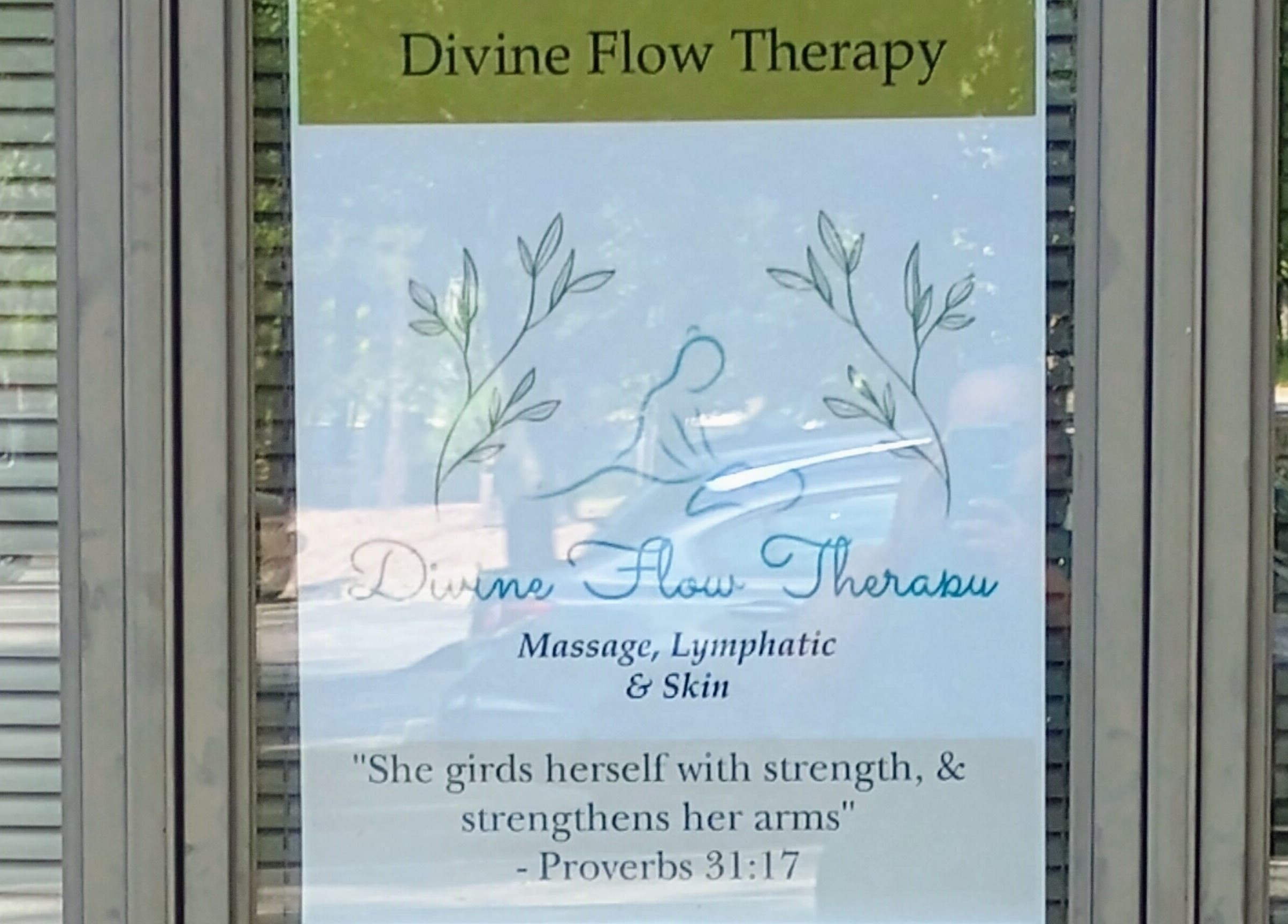 Sign at Divine Flow Therapy offering massage and skincare in Gibbsboro, New Jersey, US.