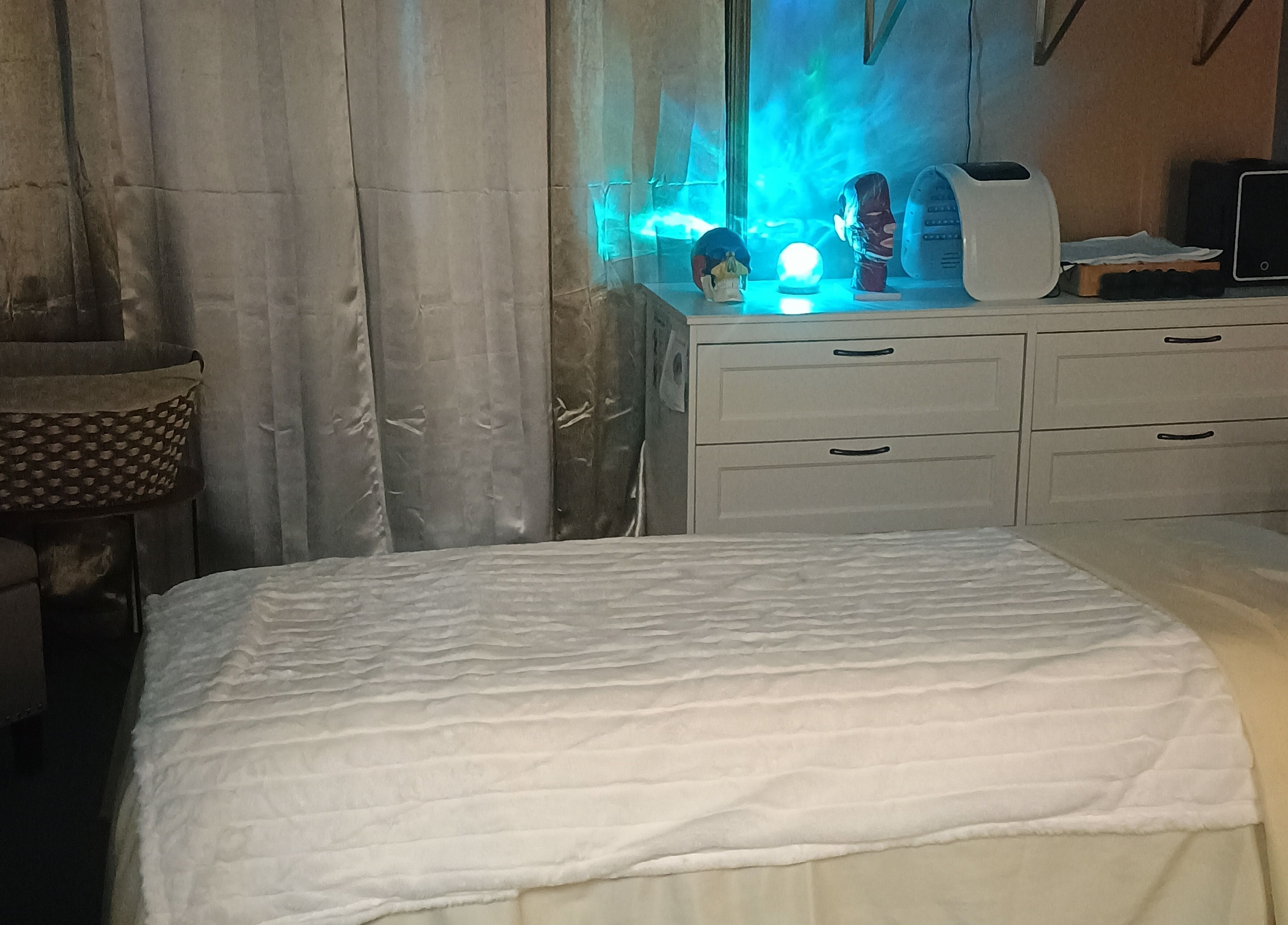 Cozy wellness room at Divine Flow Therapy in Gibbsboro, New Jersey, US, featuring a tranquil massage bed.