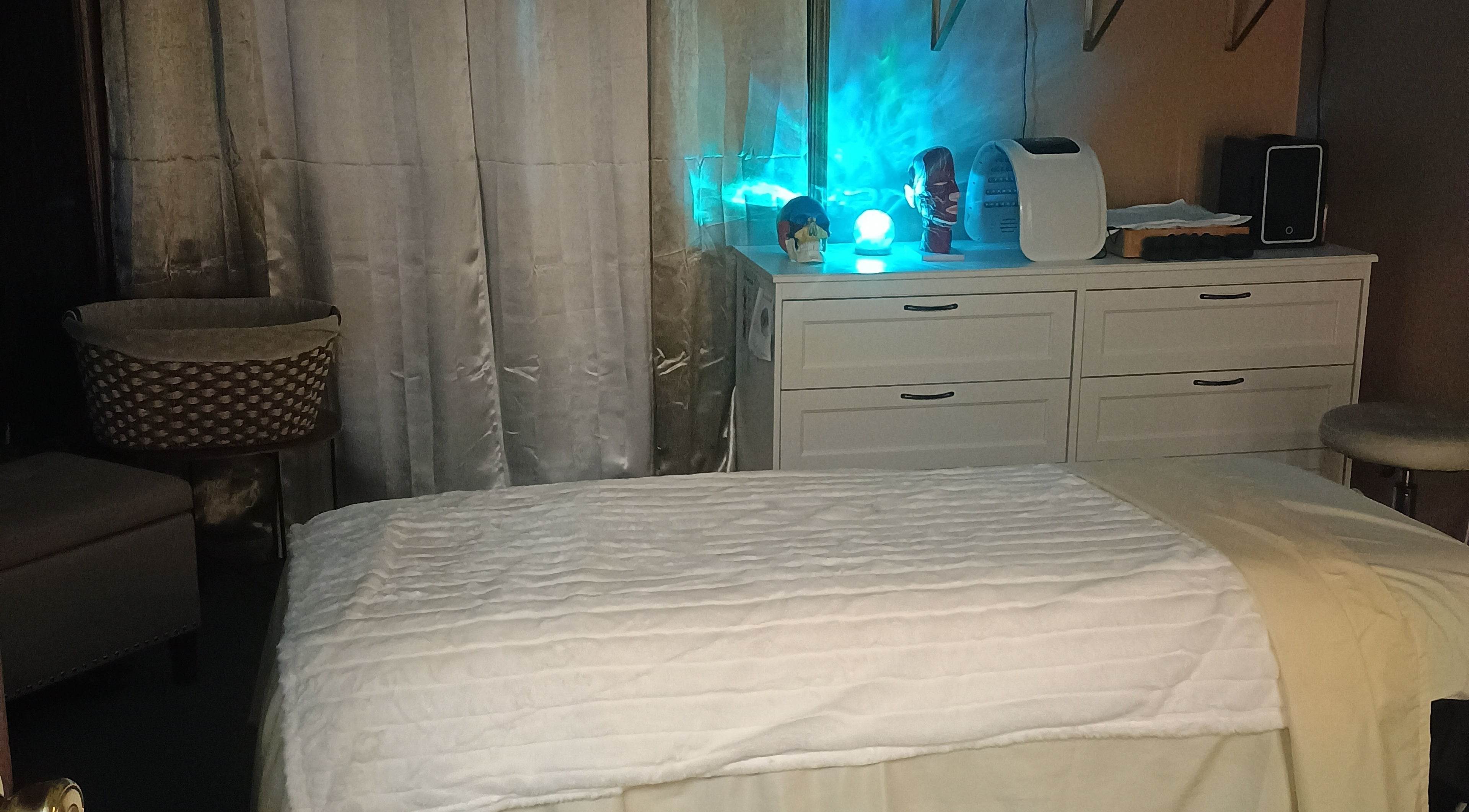 Cozy wellness room at Divine Flow Therapy in Gibbsboro, New Jersey, US, featuring a tranquil massage bed.