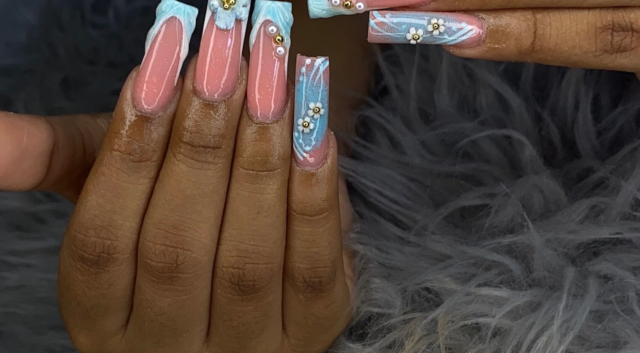 Stunning nail art with pink and blue hues at Honey Nail Lounge in Georgetown, Demerara-Mahaica, GY.