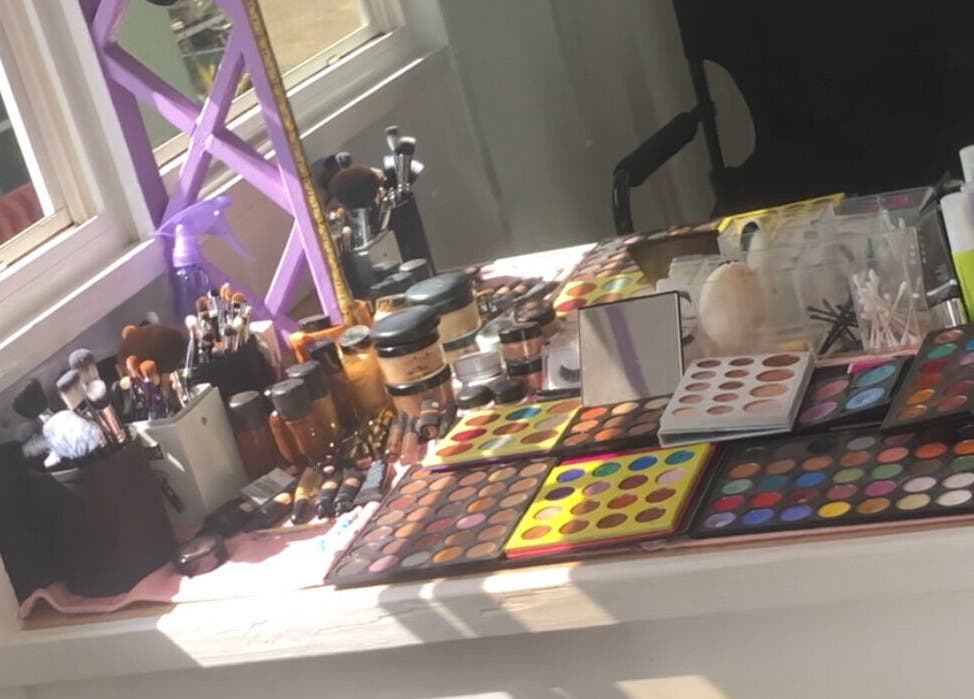Vibrant makeup station at Real Beauty Studio, Saint George, Saint George, BB, showcasing colorful palettes and tools.