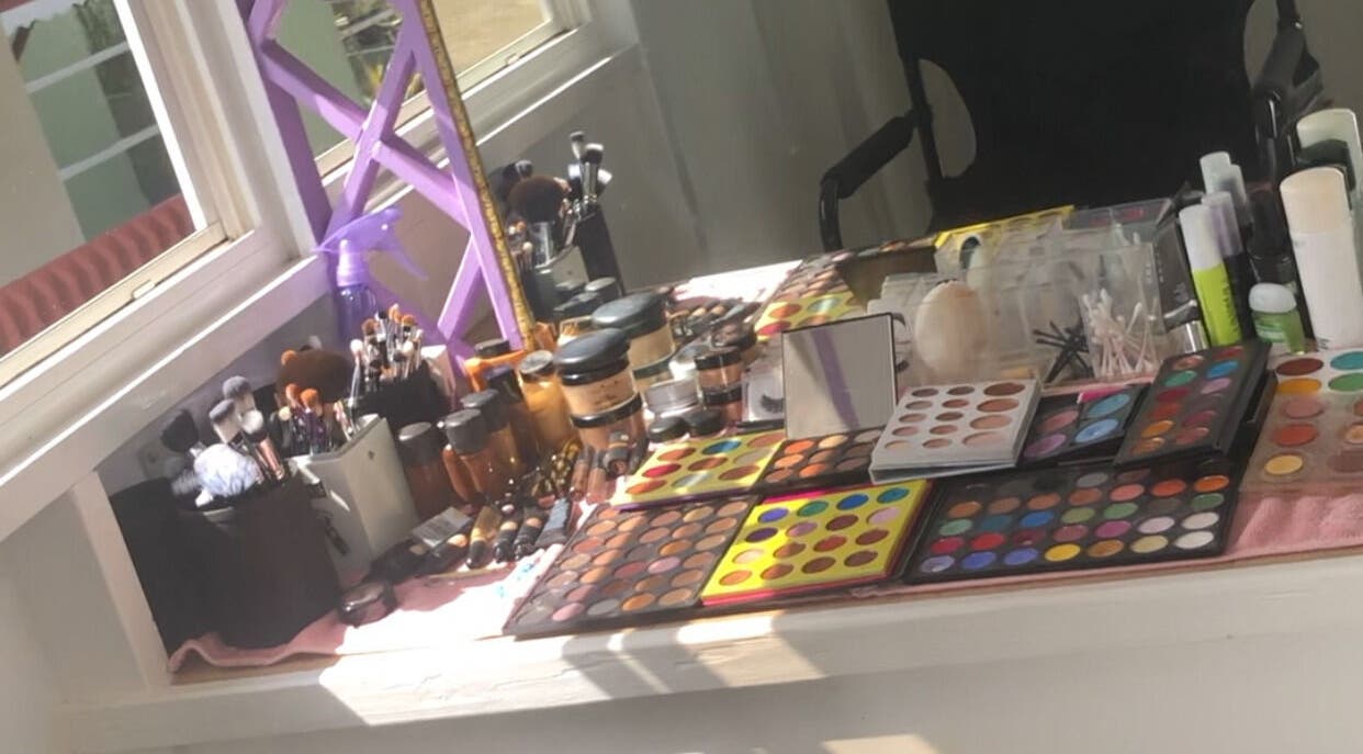 Vibrant makeup station at Real Beauty Studio, Saint George, Saint George, BB, showcasing colorful palettes and tools.