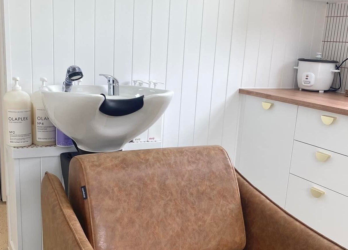 Elegant salon wash station at Prosper Studio, Belmont, Victoria, AU, featuring premium products and sleek design.