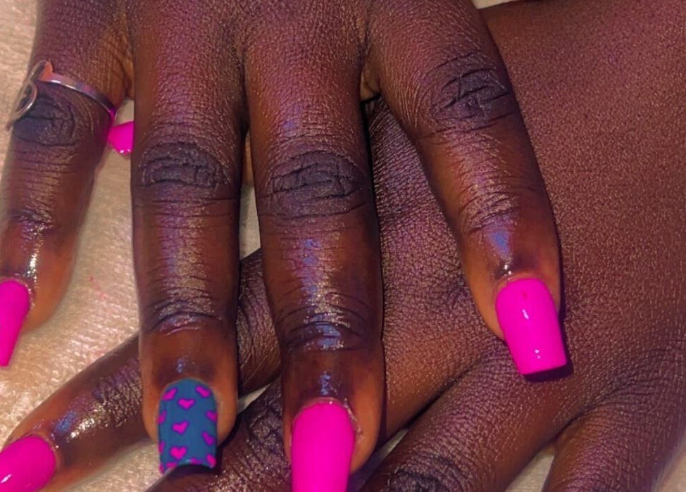 Bright pink nail art with heart designs at CANDIA BEAUTY, Nairobi, Nairobi County, KE.