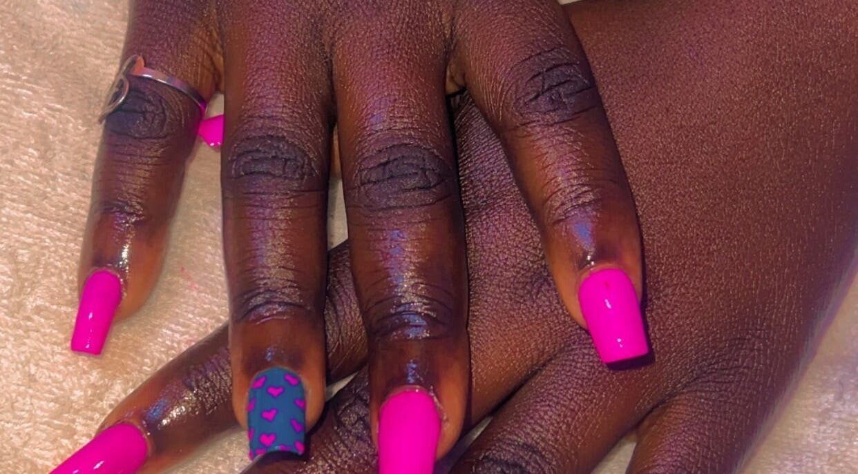 Bright pink nail art with heart designs at CANDIA BEAUTY, Nairobi, Nairobi County, KE.