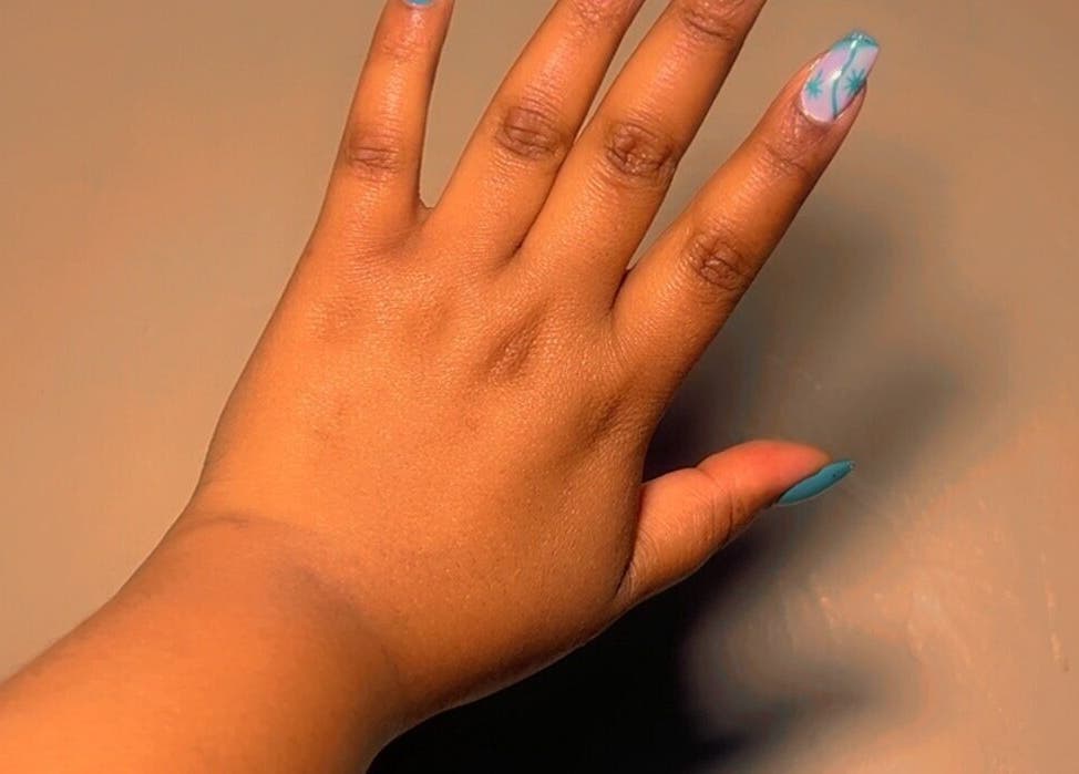 Stylish nail art at CANDIA BEAUTY, Nairobi, Nairobi County, KE. Showcasing turquoise and patterned designs.