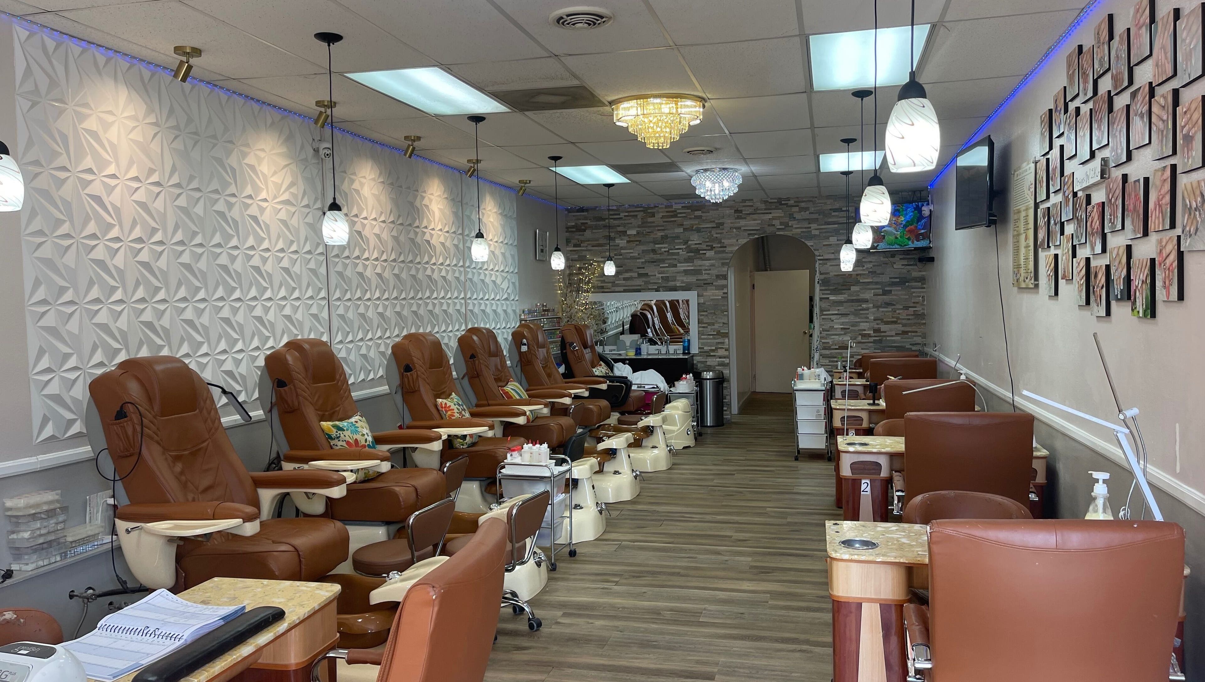 Interior of 2K Nails Spa in Los Angeles, California, US featuring plush chairs and modern decor.