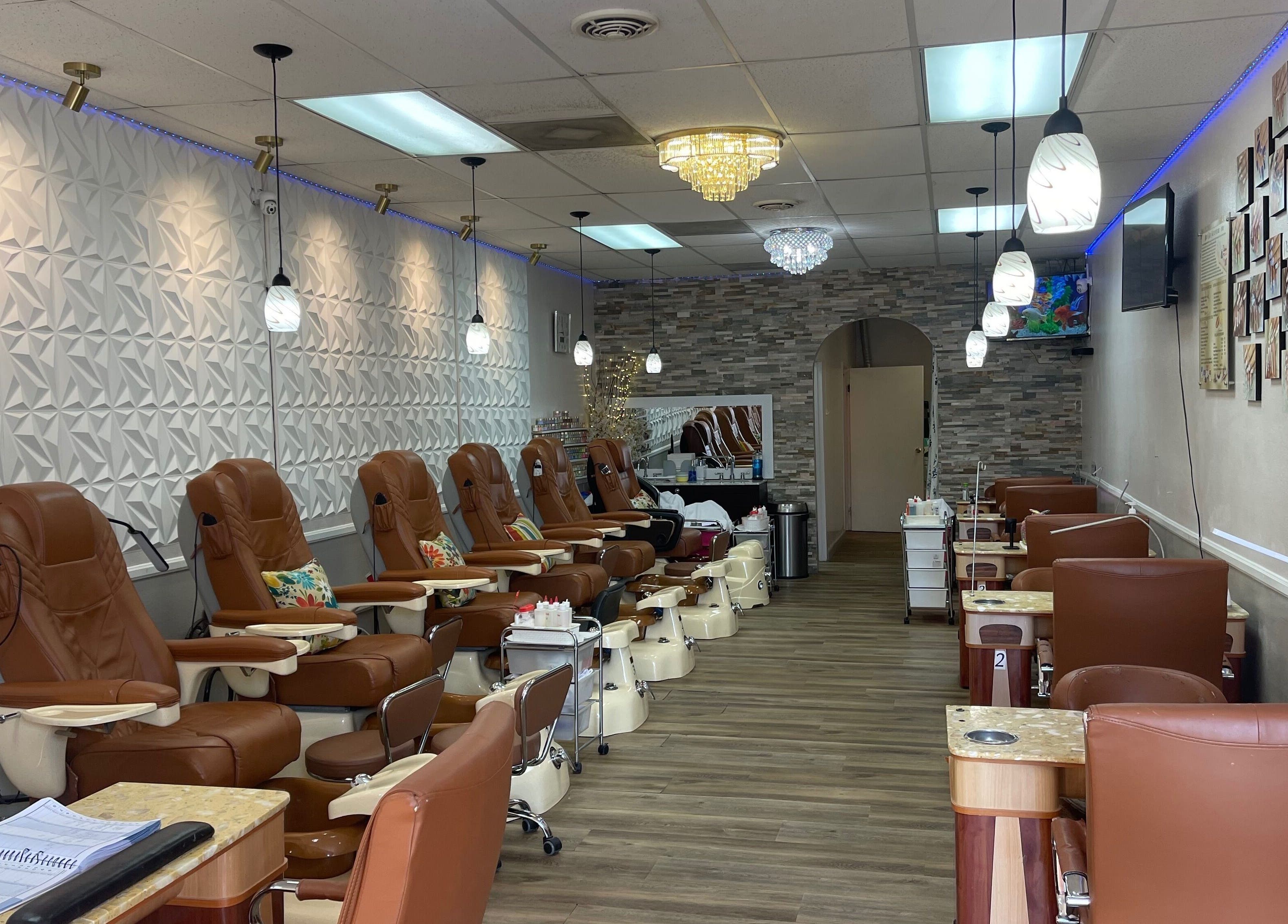Interior of 2K Nails Spa in Los Angeles, California, US featuring plush chairs and modern decor.