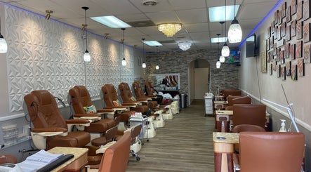 Interior of 2K Nails Spa in Los Angeles, California, US featuring plush chairs and modern decor.