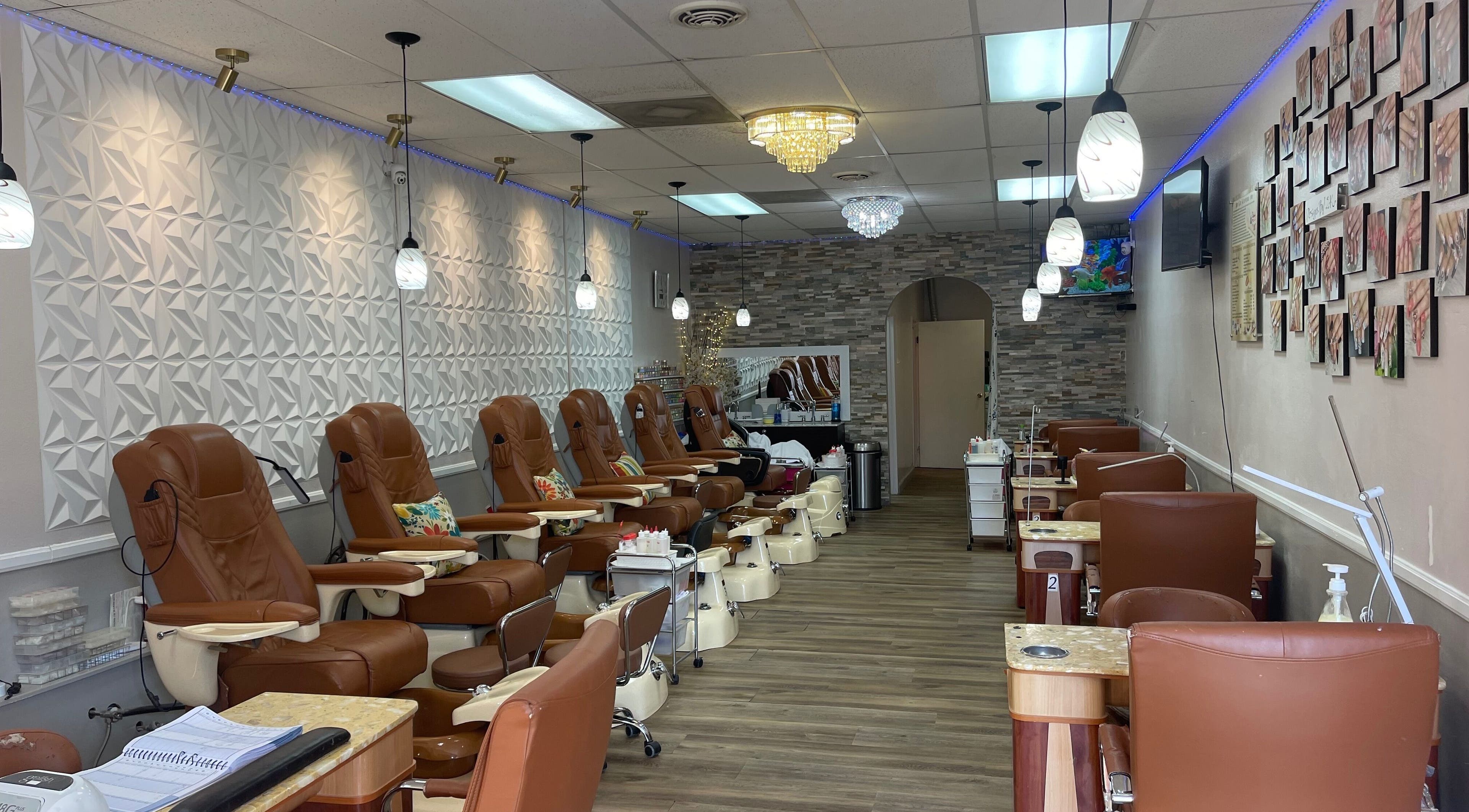 Interior of 2K Nails Spa in Los Angeles, California, US featuring plush chairs and modern decor.